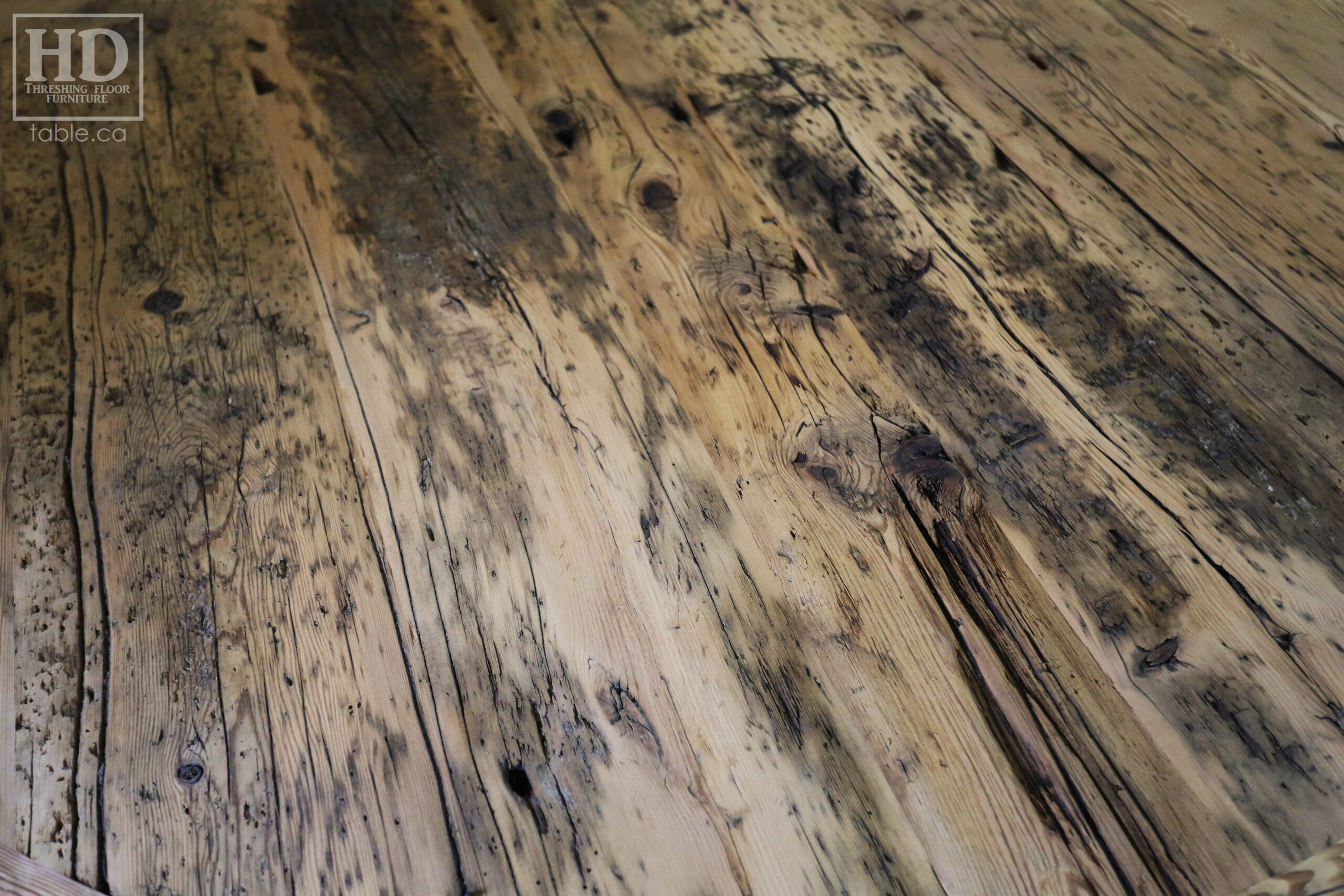 60" Round Reclaimed Wood Table - Hand-Hewn Beam Base - Hemlock Threshing Floor 2" Top - Original edges & distressing maintained - Premium epoxy clearcoat [medium thickness] + satin polyurethane finish - www.table.ca