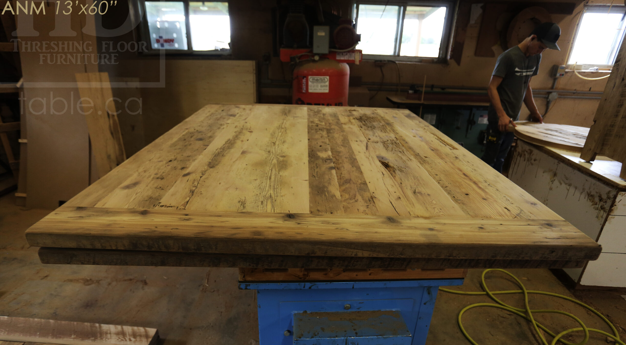 13' Ontario Barnwood Boardroom Table we made for a Toronto company - 60" wide - Matte Black U Shaped Metal Base - 2" Hemlock Threshing Floor Top - Original edges & distressing maintained - Premium epoxy + satin polyurethane finish - www.table.ca