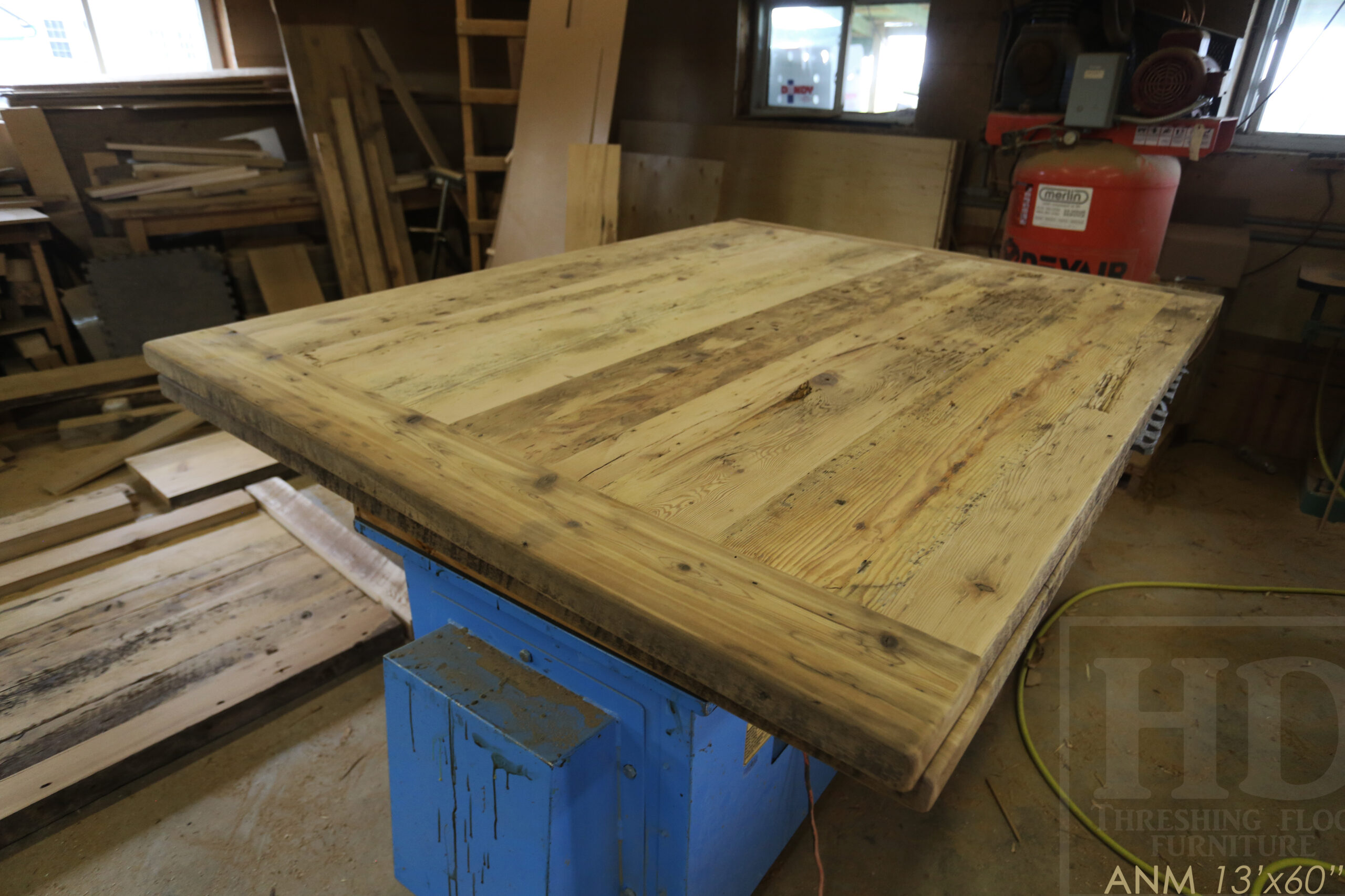 13' Ontario Barnwood Boardroom Table we made for a Toronto company - 60" wide - Matte Black U Shaped Metal Base - 2" Hemlock Threshing Floor Top - Original edges & distressing maintained - Premium epoxy + satin polyurethane finish - www.table.ca