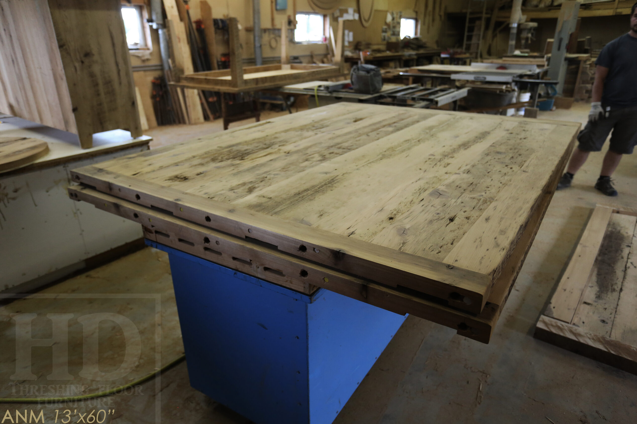 13' Ontario Barnwood Boardroom Table we made for a Toronto company - 60" wide - Matte Black U Shaped Metal Base - 2" Hemlock Threshing Floor Top - Original edges & distressing maintained - Premium epoxy + satin polyurethane finish - www.table.ca