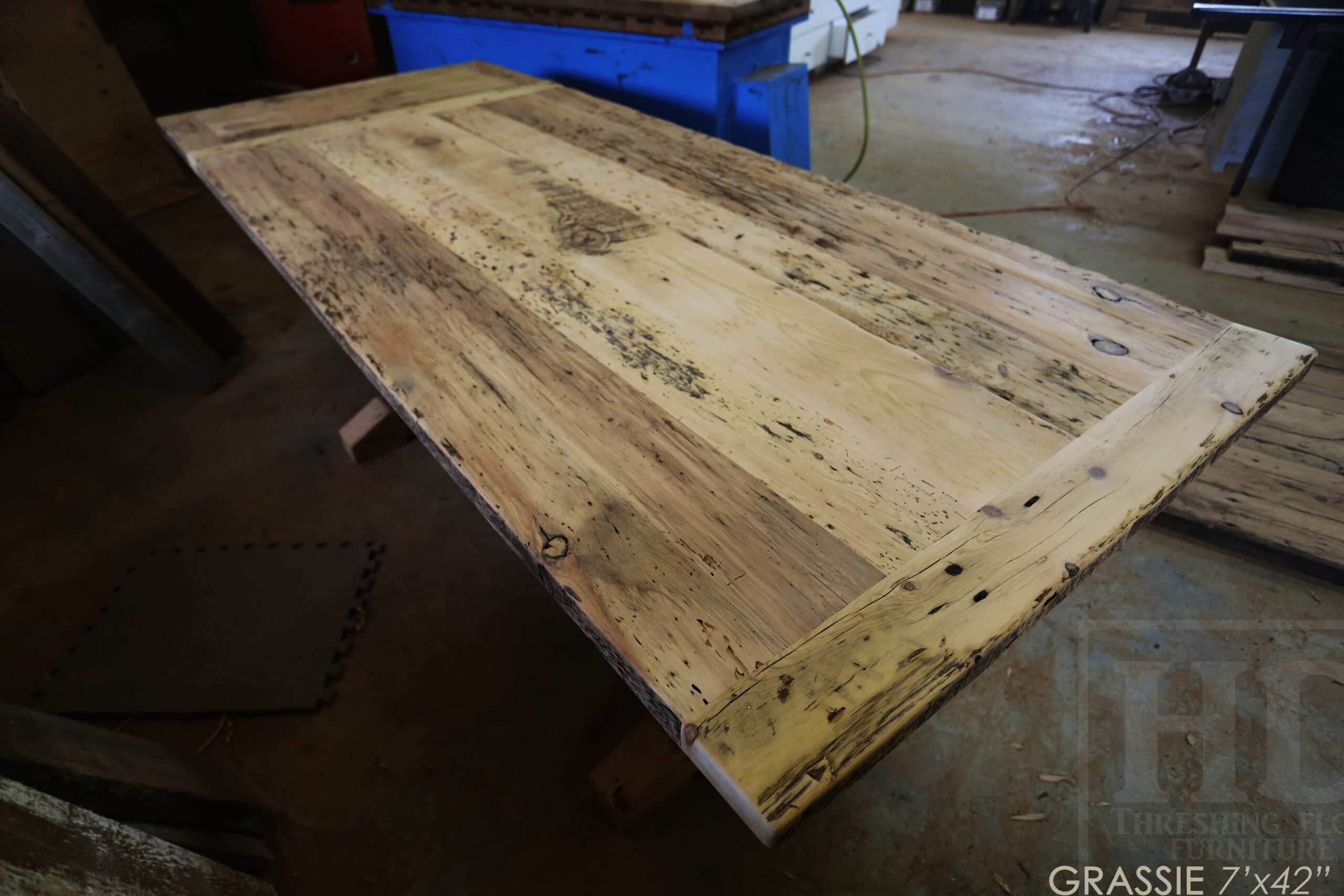 7' Ontario Barnwood Table for a Grassie, Ontario Home - 42" wide - Trestle Base - Reclaimed Old Growth Pine Threshing Floor Construction - Original Distressing & Character & Edges Maintained - Premium epoxy + satin polyurethane finish - One 18" Leaf Extension - 7' [matching] Trestle Bench - 5 Wormy Maple Chairs - Stained to match table - www.table.ca