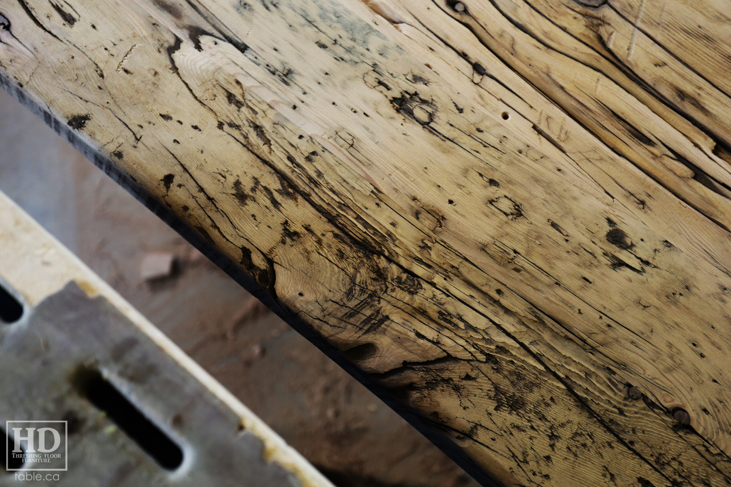 12’ Ontario Barnwood Boardroom Table we made for a Stratford, Ontario company – Modern 3” Plank Base – Old Growth Hemlock Threshing Floor Construction – Original distress & edges maintained – Premium epoxy + satin polyurethane finish – Steel logo embedded / www.table.ca