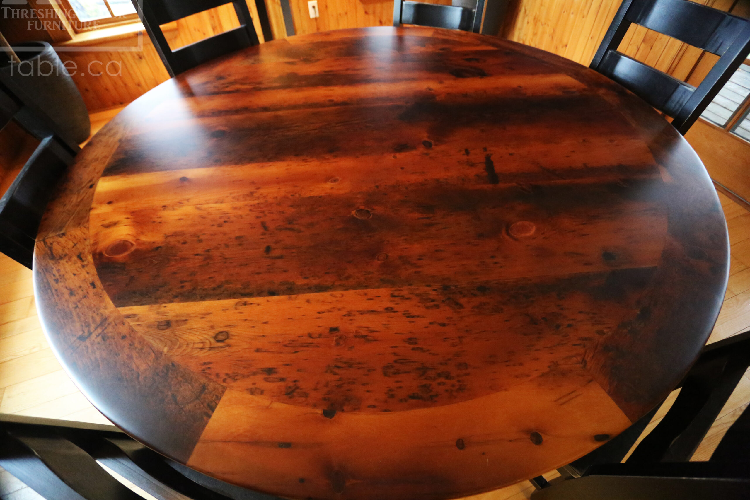 72" Round Ontario Barnwood Table we made for a Pakenham, Ontario Home - Reclaimed cedar hydro pole base - Old Growth Hemlock Threshing Floor Construction - Original Distressing & Character & Edges Maintained - Premium epoxy + matte polyurethane finish - 6 Ladder Back Chairs / Wormy Maple / Custom finished / Polyurethane clearcoat finish - www.table.ca