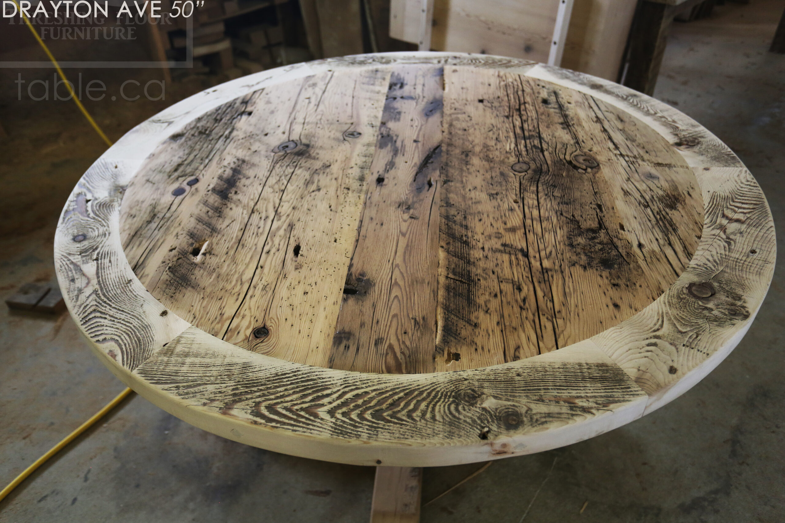 50" Ontario Barnwood Round Table we made for an Toronto, Ontario home - Round Cedar Hydro Pole Base - 2" Hemlock Threshing Floor Top -  Original edges & distressing maintained - Greytone Treatment Option [maintains the light colour of unfinished] - Premium epoxy + matte polyurethane finish - www.table.ca