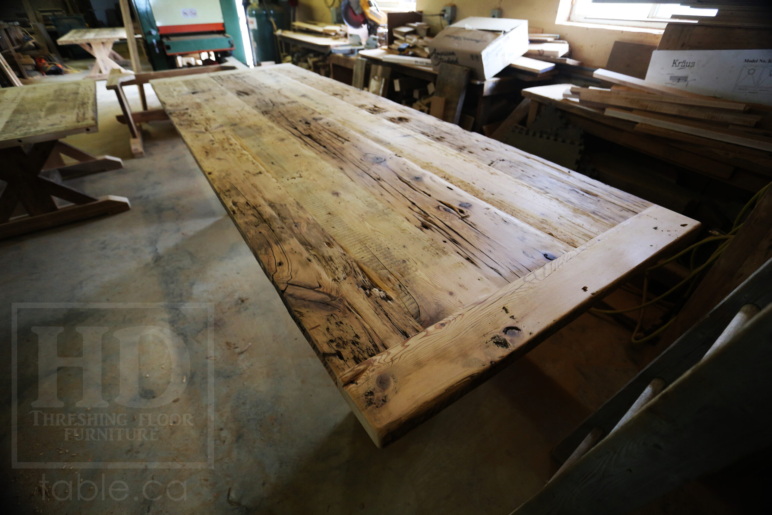 10' Ontario Barnwood Modern Table we made for an Innerskip, Ontario home - 42" wide - 36" [Counter] Height - Plank Base - 2" Hemlock Threshing Floor Top - Original edges & distressing maintained - Premium epoxy + satin polyurethane finish - www.table.ca