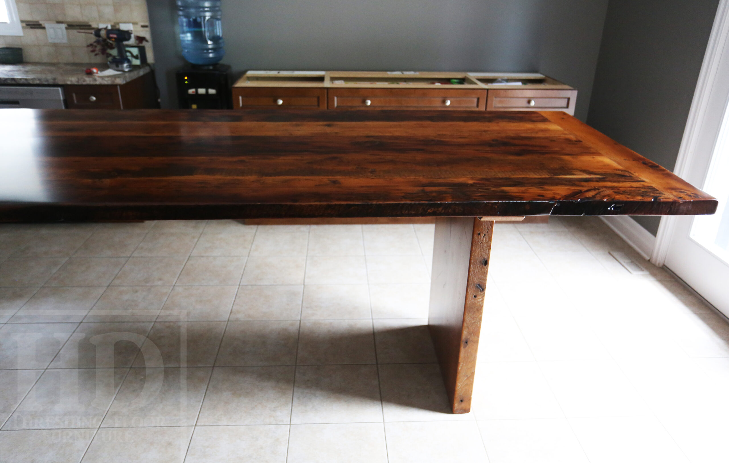 10' Ontario Barnwood Modern Table we made for an Innerskip, Ontario home - 42" wide - 36" [Counter] Height - Plank Base - 2" Hemlock Threshing Floor Top - Original edges & distressing maintained - Premium epoxy + satin polyurethane finish - www.table.ca