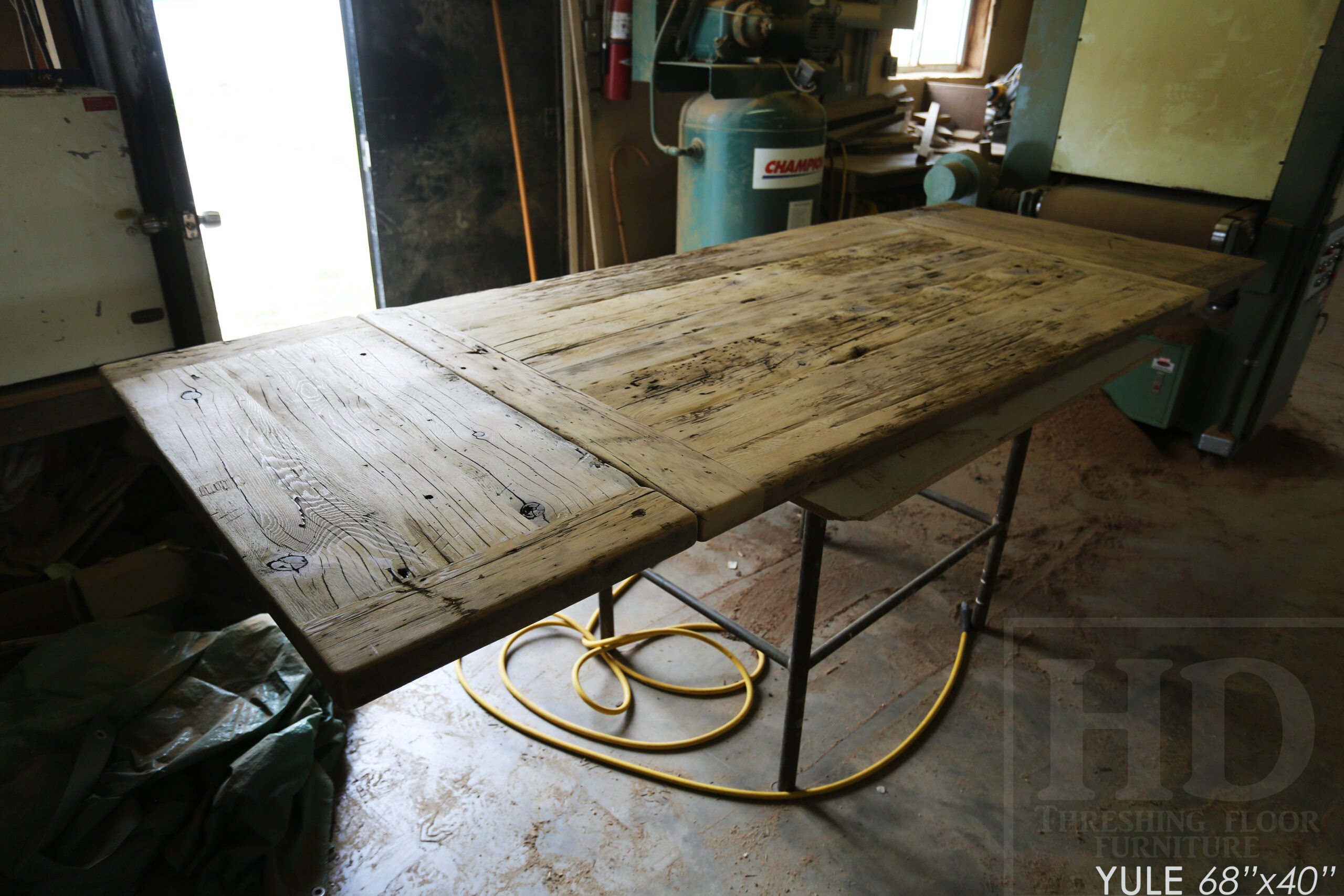 68" Ontario Barnwood Table we made for an Kitchener, Ontario home - 40" wide - Matte Black X Base - 2" Hemlock Threshing Floor Top -  Original edges & distressing maintained - Premium epoxy + satin polyurethane finish - Two 18" Leaves - 68" [matching] Reclaimed Wood Bench - www.table.ca