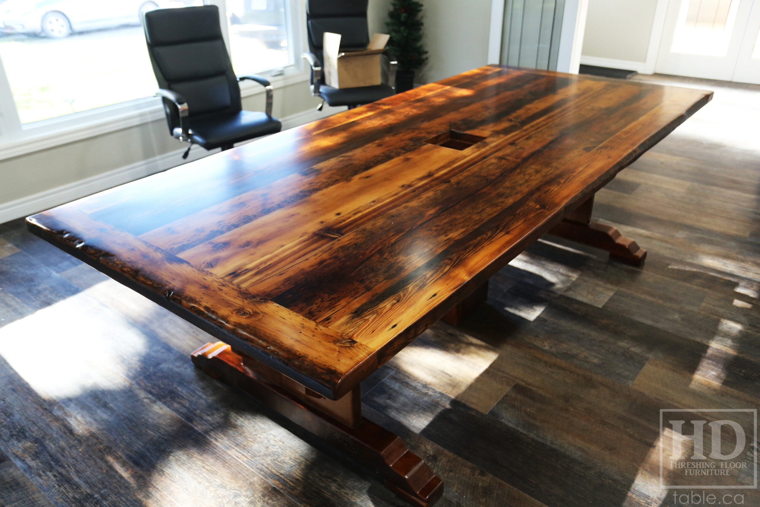 9’ Reclaimed Ontario Barnwood Boardroom Table we made for a Simcoe, Ontario home – 48” wide – Trestle Base with Curved Profile Foot Option – Reclaimed Hemlock Threshing Floor Construction – Original edges & distressing maintained – Cut out for electronics box - Premium epoxy + satin polyurethane finish – Hand Applied Epoxy on Base Option - www.table.ca