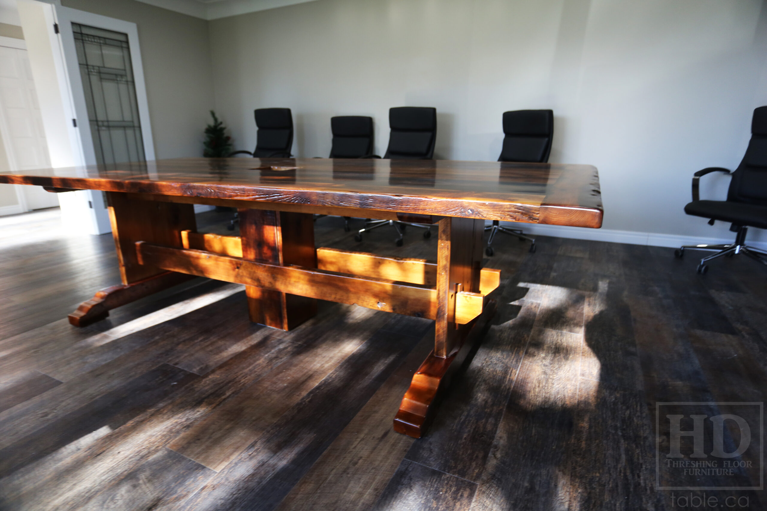 9’ Reclaimed Ontario Barnwood Boardroom Table we made for a Simcoe, Ontario home – 48” wide – Trestle Base with Curved Profile Foot Option – Reclaimed Hemlock Threshing Floor Construction – Original edges & distressing maintained – Cut out for electronics box - Premium epoxy + satin polyurethane finish – Hand Applied Epoxy on Base Option - www.table.ca