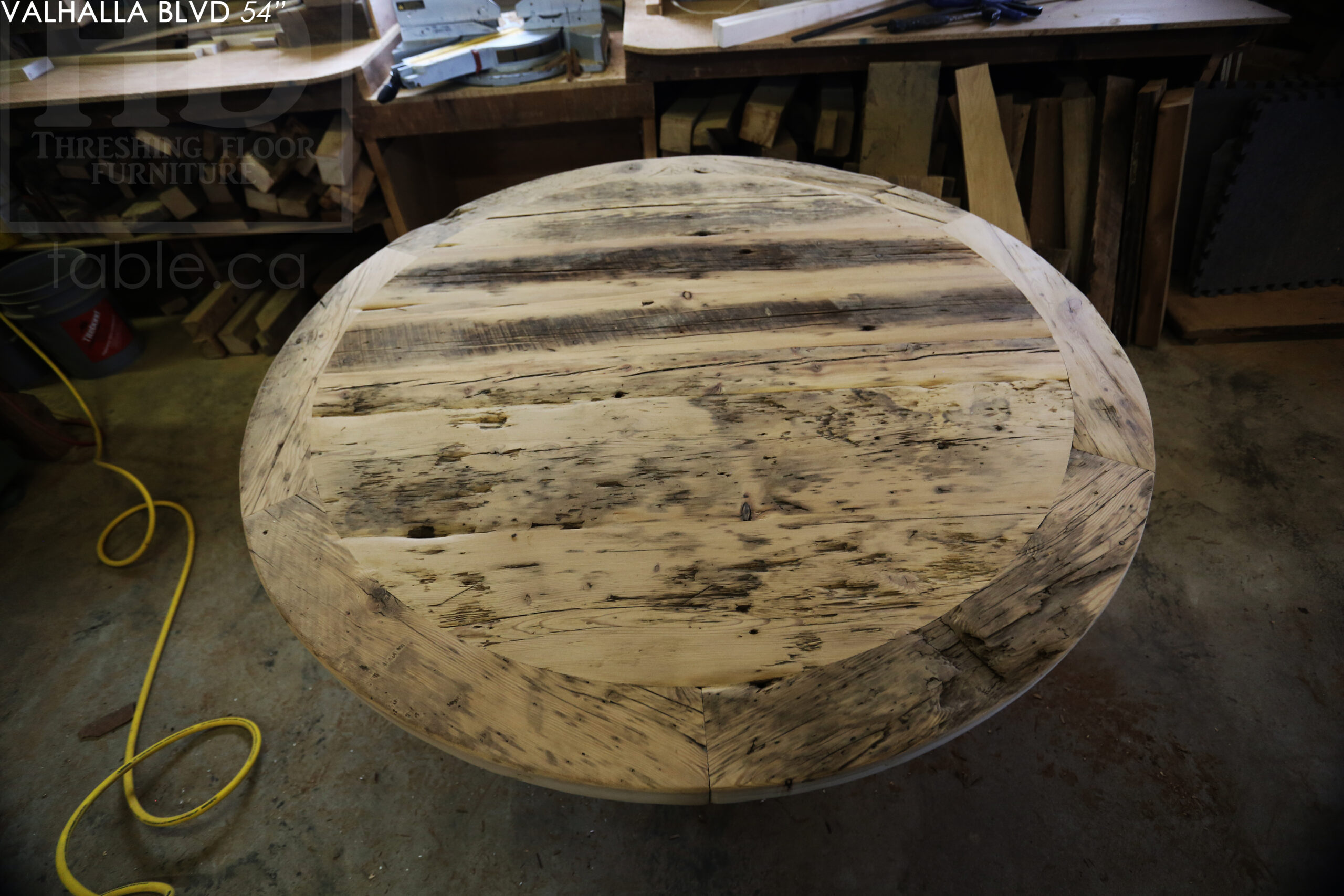 54" Ontario Barnwood Round Table we made for a Scarborough, Ontario home - Hand-Hewn Beam Pedestal Base - 2" Hemlock Threshing Floor Construction top - Greytone Option to maintain the colour of unfinished - Original edges & distressing maintained - Premium epoxy + matte polyurethane finish - www.table.ca