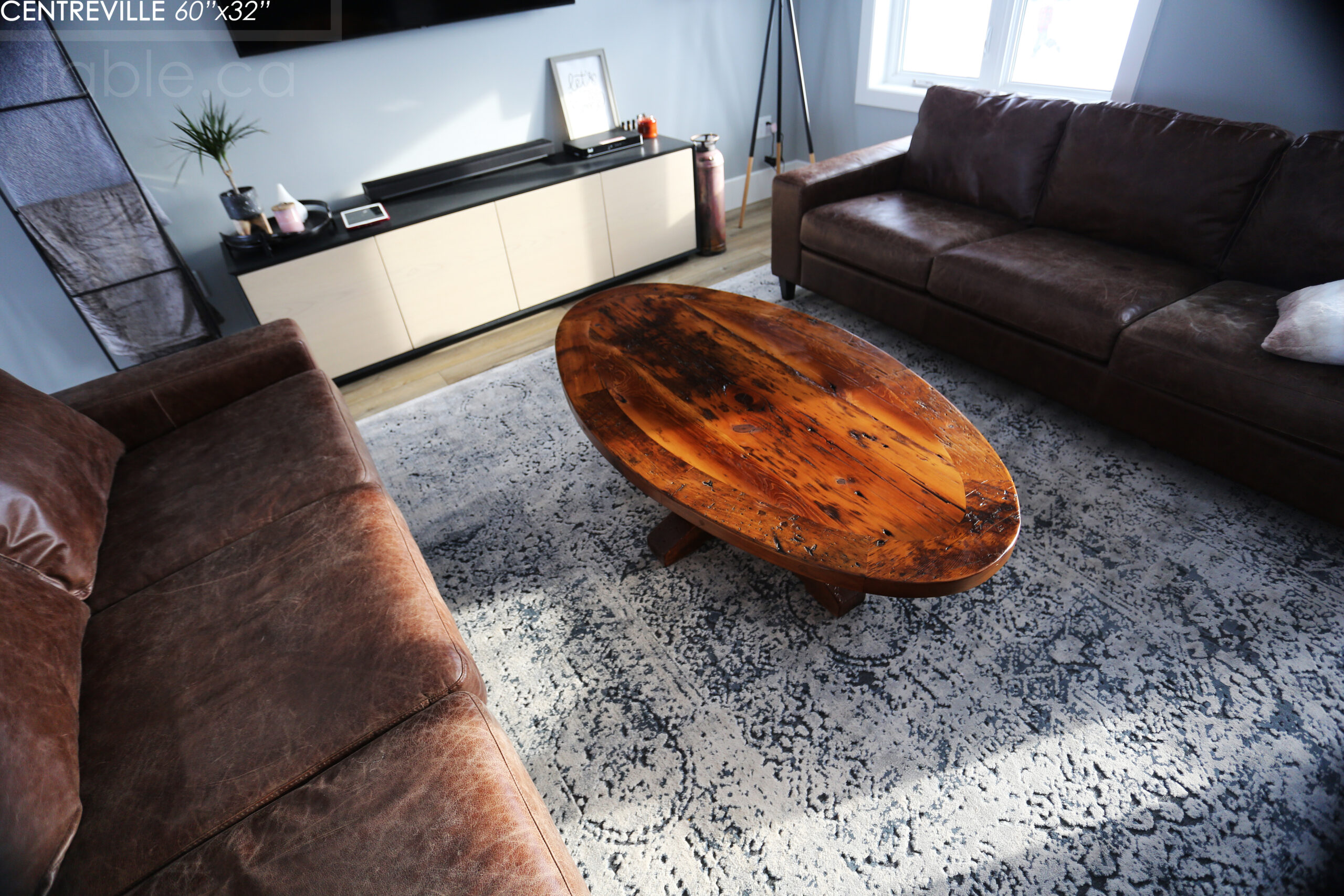 60" Ontario Barnwood Coffee Table we made for an Ingersoll, Ontario home - 32" wide in centre - Eliptical shaped - Hand-Hewn Beam Pedestal Base - 2" Old Growth Pine Threshing Floor Construction top - Original edges & distressing maintained - Satin polyurethane finish - www.table.ca