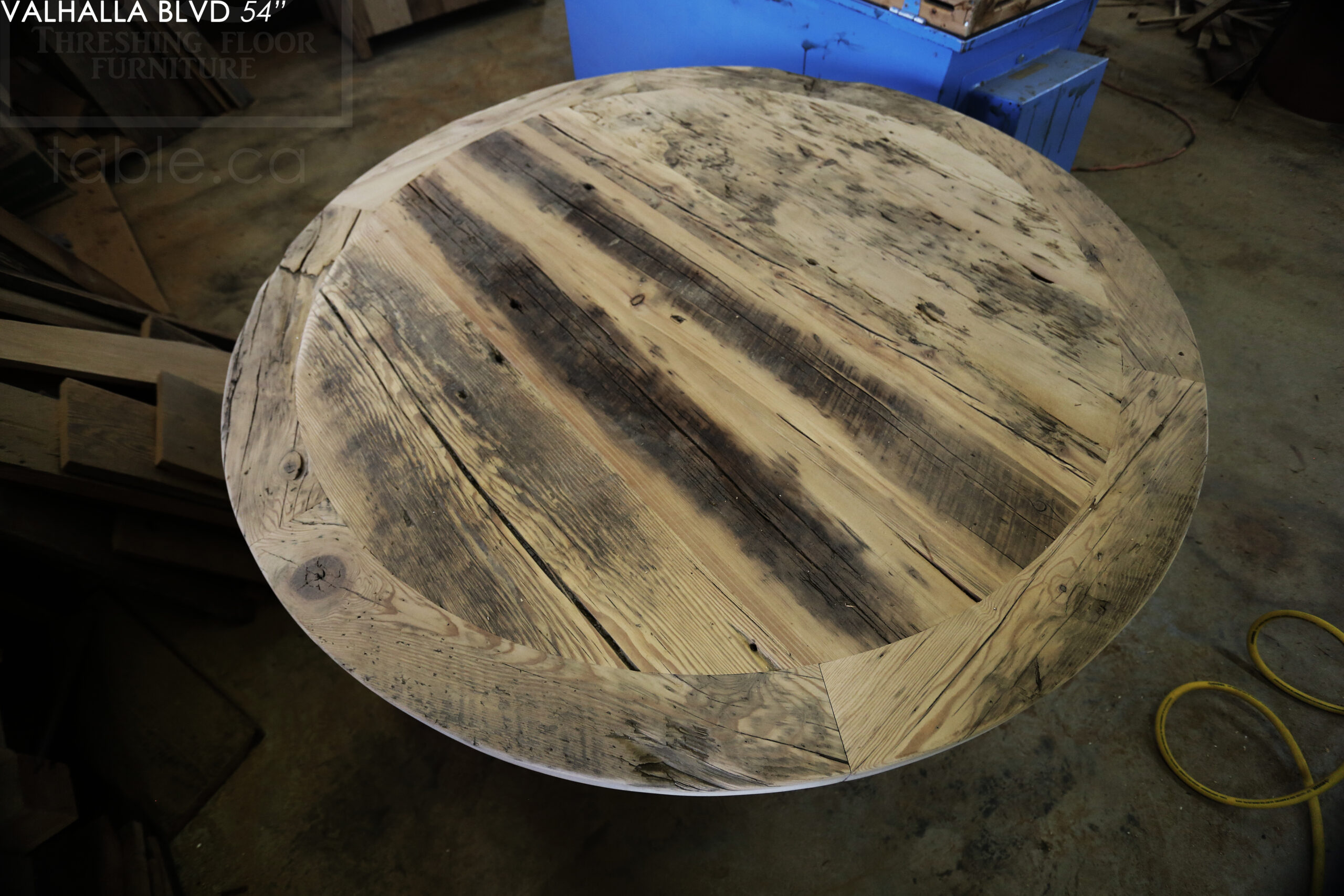 54" Ontario Barnwood Round Table we made for a Scarborough, Ontario home - Hand-Hewn Beam Pedestal Base - 2" Hemlock Threshing Floor Construction top - Greytone Option to maintain the colour of unfinished - Original edges & distressing maintained - Premium epoxy + matte polyurethane finish - www.table.ca