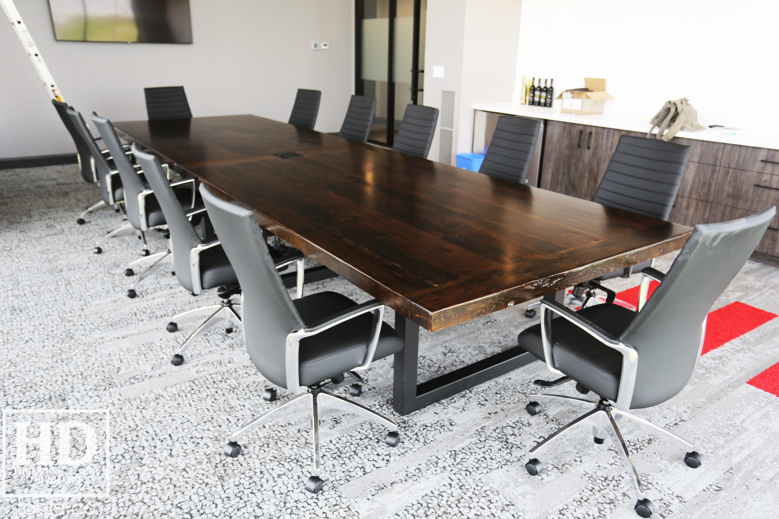Project details: 17' Ontario Barnwood Boardroom Wood Table we made for a Beamsville, Ontario company - 60" wide â€“ Steel U Shaped Base â€“ Reclaimed Old Growth Hemlock Threshing Floor Construction â€“ Black Stain Option â€“ Centre on-site doweling - Original edges & distressing maintained â€“ Premium epoxy + Satin polyurethane finish  â€“ www.table.ca