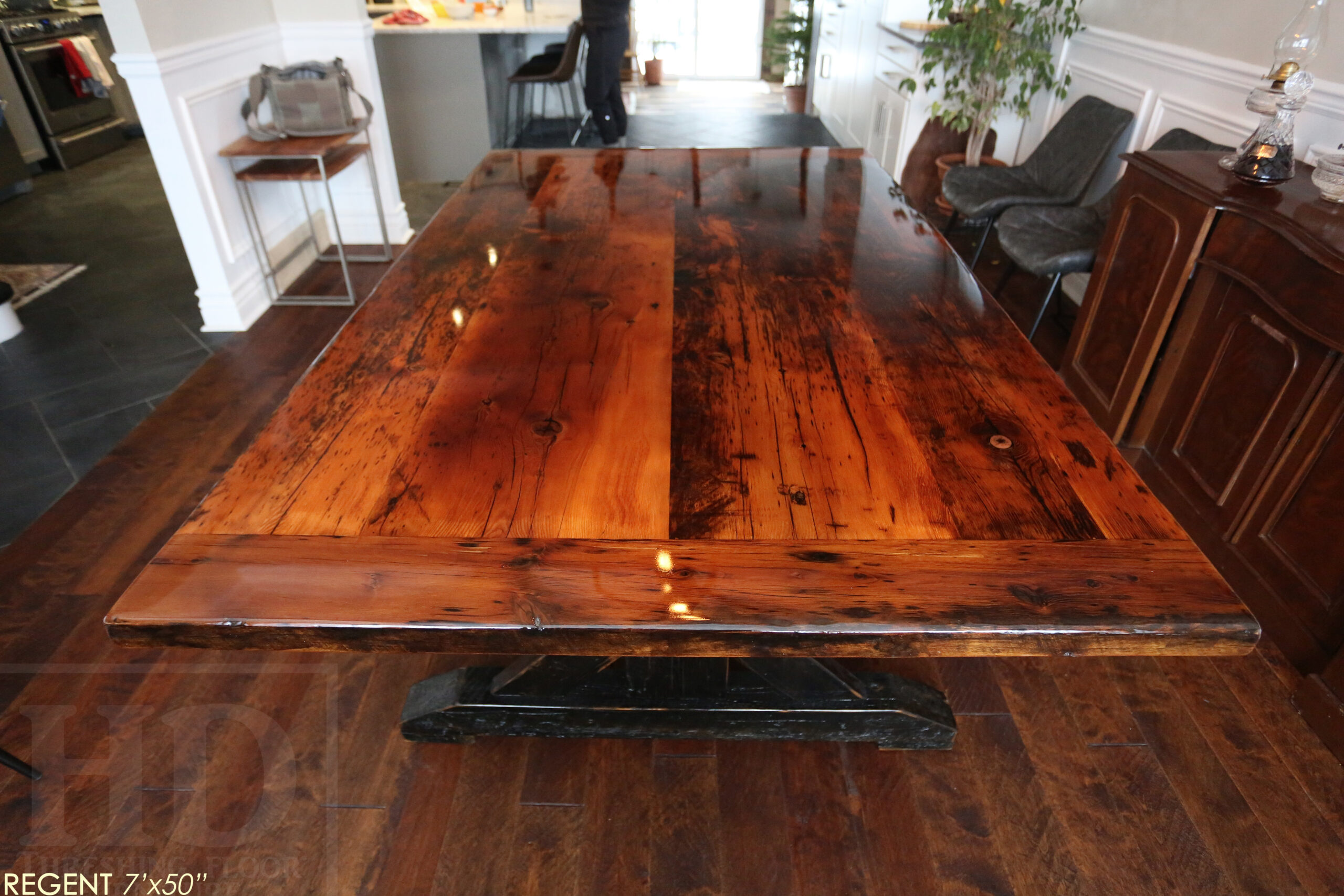 7 ft Reclaimed Ontario Barnwood Table we made for a Cambridge, Ontario home - 50â€ wide â€“ Sawbuck Base - Reclaimed Hemlock Threshing Floor Construction â€“ Original edges & distressing maintained â€“ Premium epoxy + High Gloss Option polyurethane finish â€“ Black painted with sandthroughs base - www.table.ca