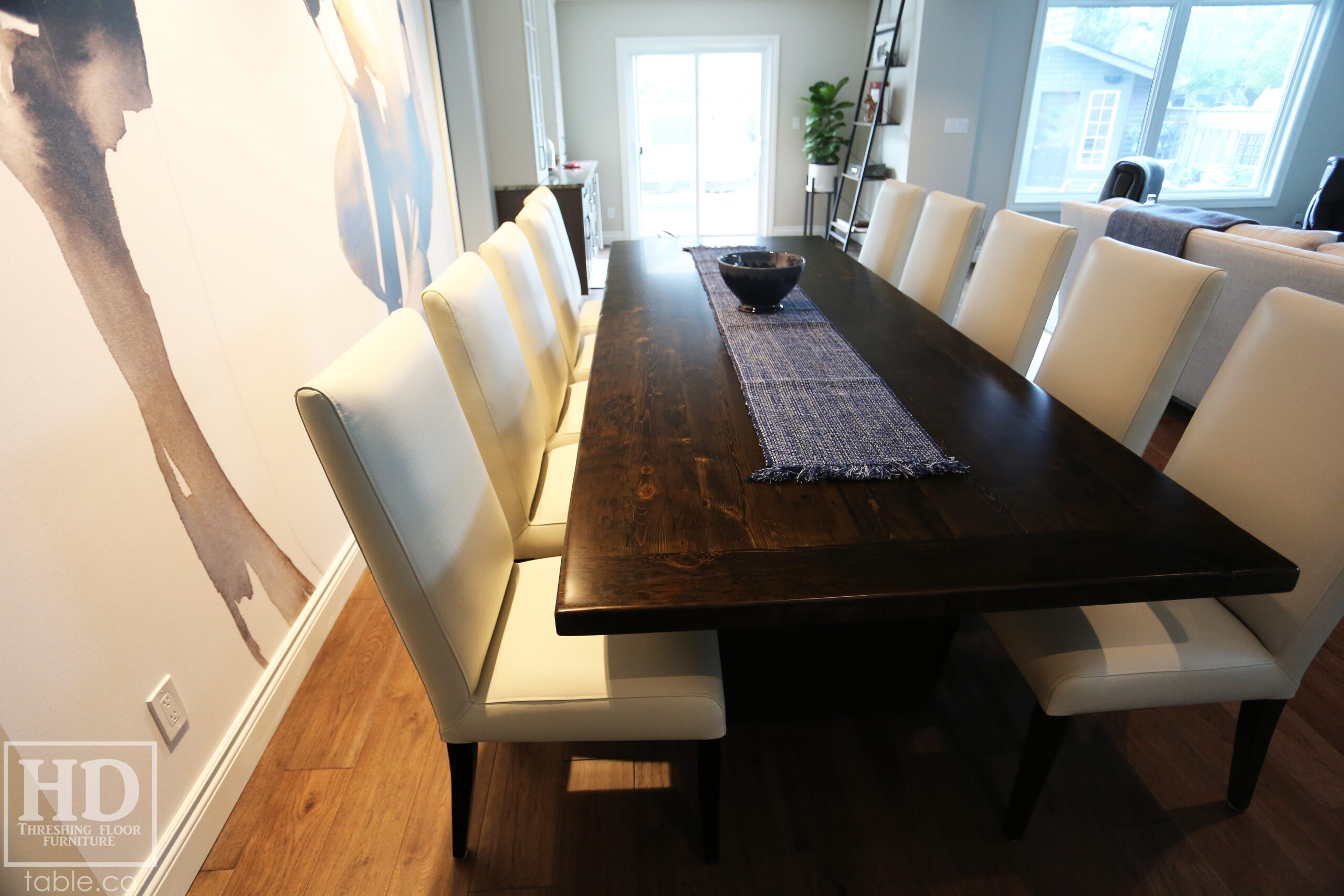 10 ft Reclaimed Ontario Barnwood Table we made for a Waterloo, Ontario home – 44” wide – Modern Plank Base [with Bottom Rail Option] – Reclaimed Hemlock Threshing Floor Construction – Original edges & distressing maintained – Black Stain Option - Premium epoxy + satin polyurethane finish – 10 Topgrain Leather Parsons Chairs [Santiago Moon Colour] - www.table.ca