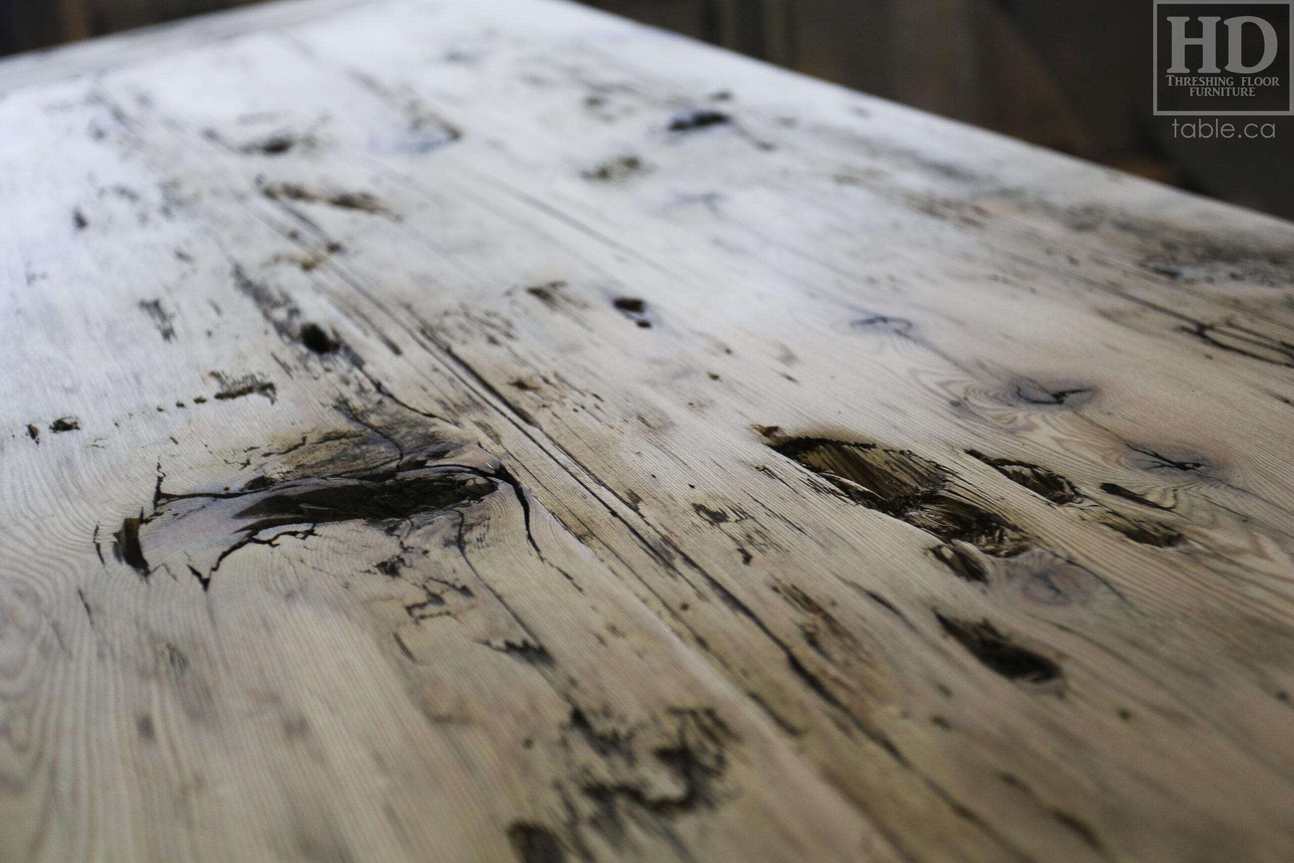 Custom Ontario Barnwood Desk â€“ Barn Beam Posts â€“ Modified Shape to Accommodate a Unique Space - Reclaimed Hemlock Threshing Floor 2â€ Top â€“ Original edges & distressing maintained  â€“ www.table.ca