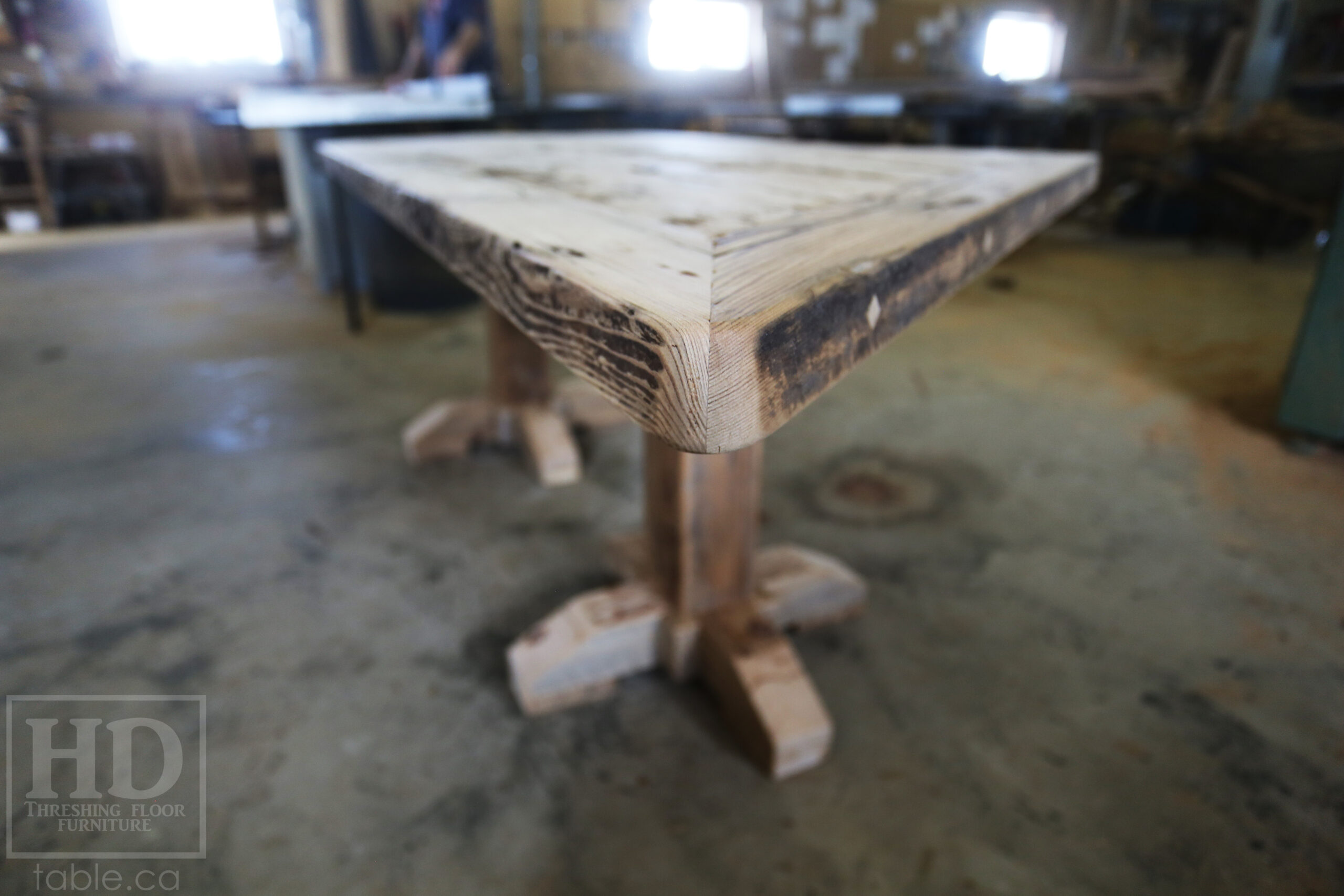 Custom Ontario Barnwood Desk â€“ Barn Beam Posts â€“ Modified Shape to Accommodate a Unique Space - Reclaimed Hemlock Threshing Floor 2â€ Top â€“ Original edges & distressing maintained  â€“ www.table.ca