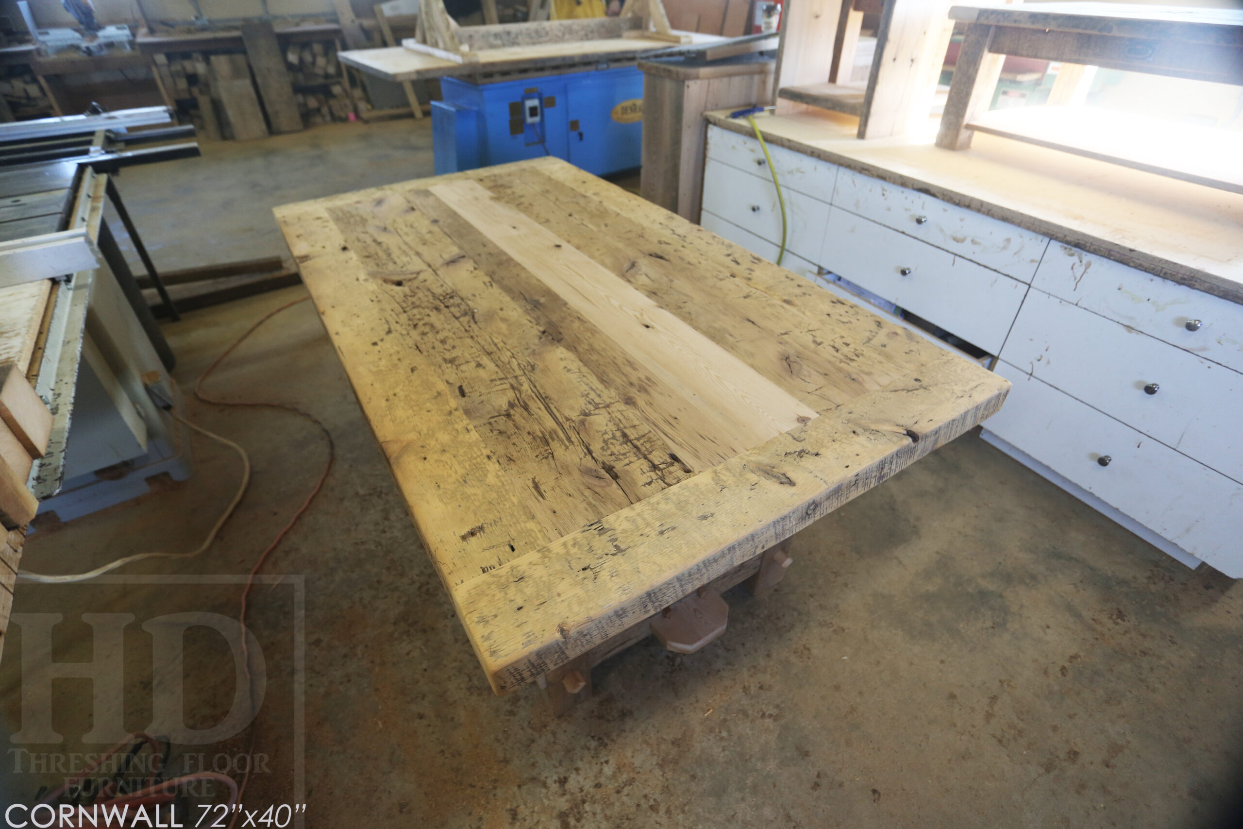 72â€ Ontario Barnwood Table we made for a Cornwall, Ontario home â€“ 40â€ wide - Frame Base / 10â€ overhand at ends â€“ Extra thick Option 3â€ Top Reclaimed Hemlock Threshing Floor Construction â€“ Original edges & distressing maintained â€“ Premium epoxy + matte polyurethane finish â€“ www.table.ca