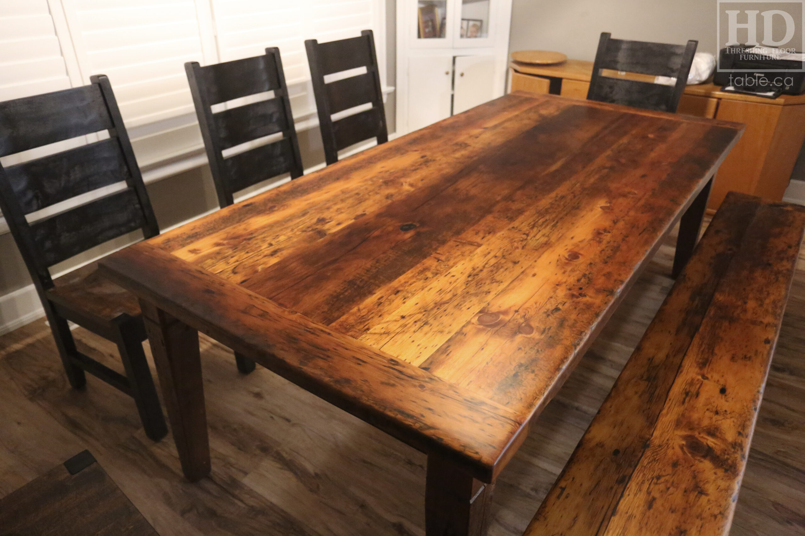 7.5’ Ontario Barnwood Table we made for a Sudbury, Ontario home – 42” wide – Harvest Base / Tapered with a Notch Windbrace Beam Legs - Reclaimed Hemlock Threshing Floor Construction – Original distressing & edges maintained – Premium epoxy + matte polyurethane finish – 7.5’ [matching] Harvest Bench – Cottager Chairs / Wormy Maple / Black Painted Frame / Seat Stained Colour of Table / Matte polyurethane clearcoat finish -  www.table.ca