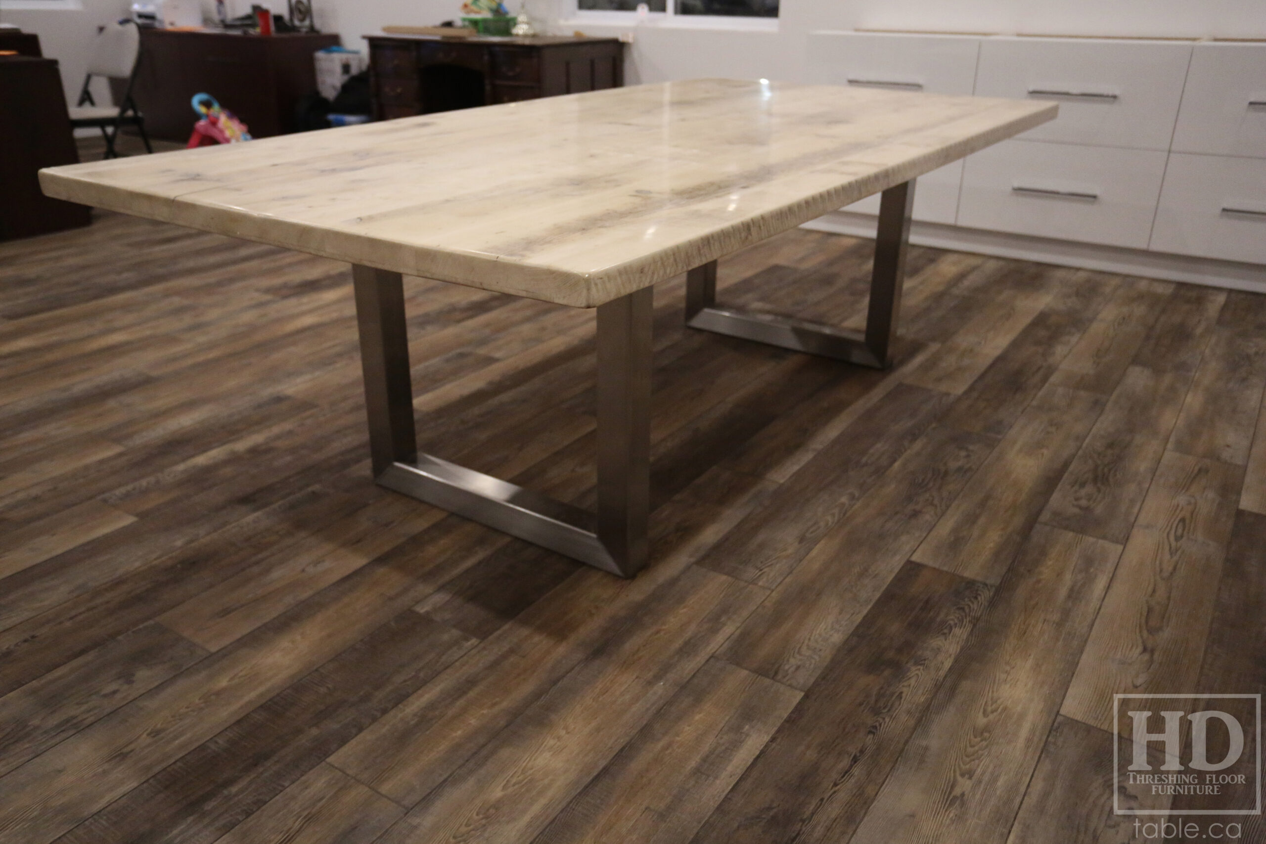 Project details: 8' Ontario Barnwood Boardroom Table - 48" wide â€“ Stainless Steel U Shaped Base â€“ Reclaimed Old Growth Hemlock Threshing Floor Construction â€“ No bread-edge boards - Original edges & distressing maintained â€“ Bleached Option - Premium epoxy + satin polyurethane finish - www.table.ca