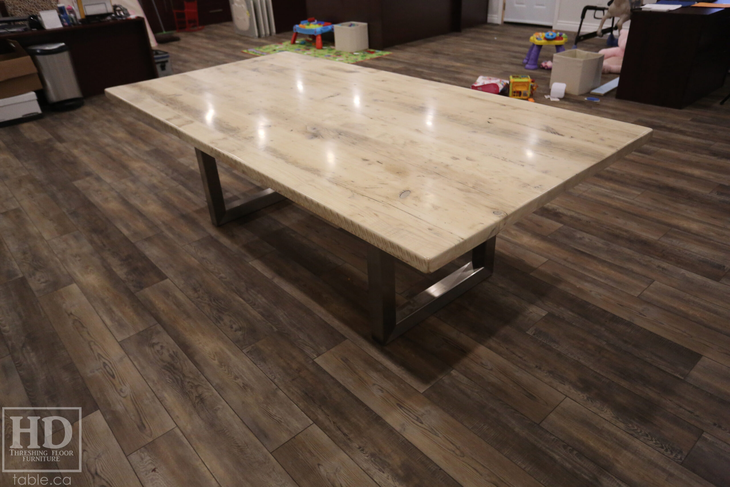 Project details: 8' Ontario Barnwood Boardroom Table - 48" wide â€“ Stainless Steel U Shaped Base â€“ Reclaimed Old Growth Hemlock Threshing Floor Construction â€“ No bread-edge boards - Original edges & distressing maintained â€“ Bleached Option - Premium epoxy + satin polyurethane finish - www.table.ca