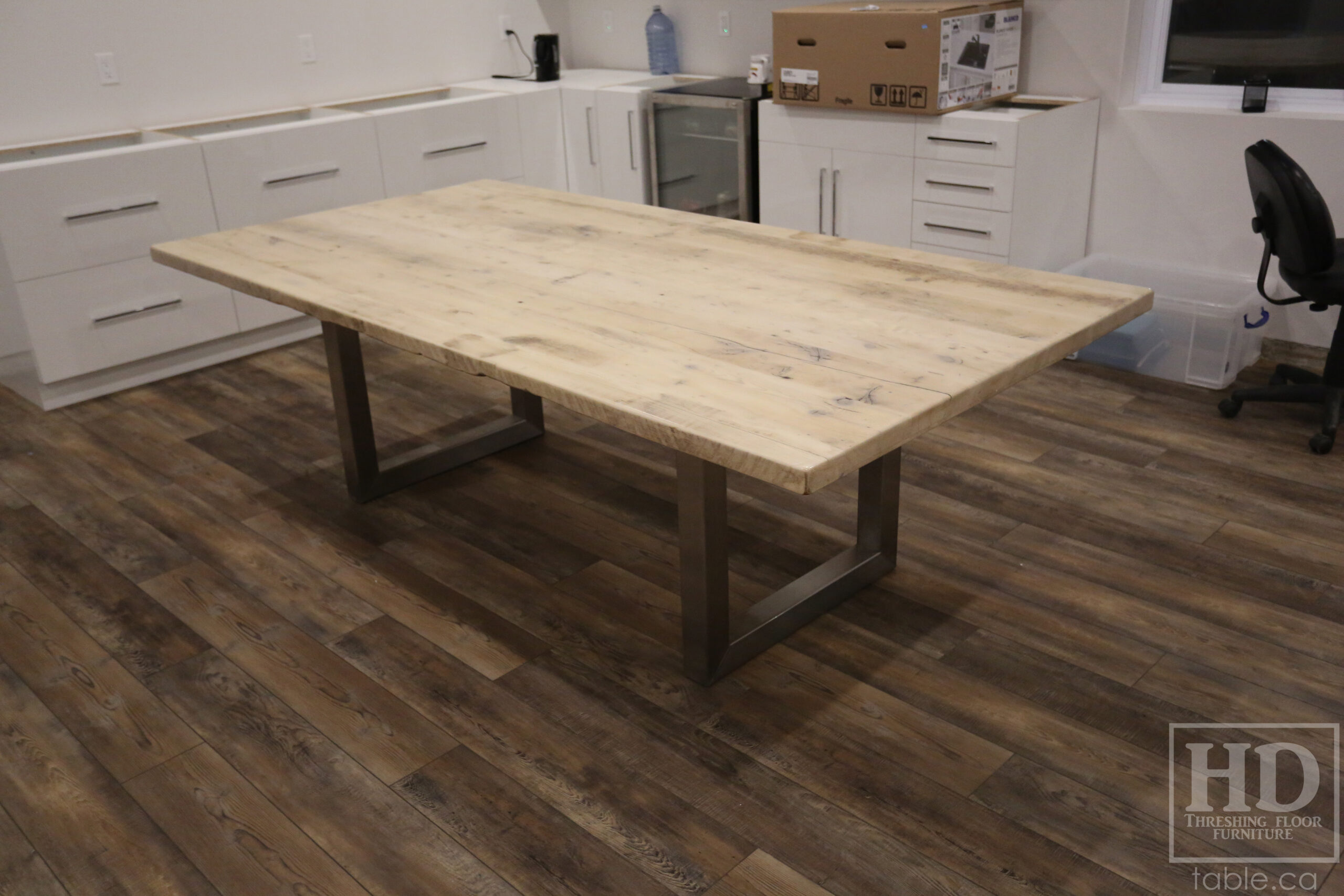 Project details: 8' Ontario Barnwood Boardroom Table - 48" wide â€“ Stainless Steel U Shaped Base â€“ Reclaimed Old Growth Hemlock Threshing Floor Construction â€“ No bread-edge boards - Original edges & distressing maintained â€“ Bleached Option - Premium epoxy + satin polyurethane finish - www.table.ca