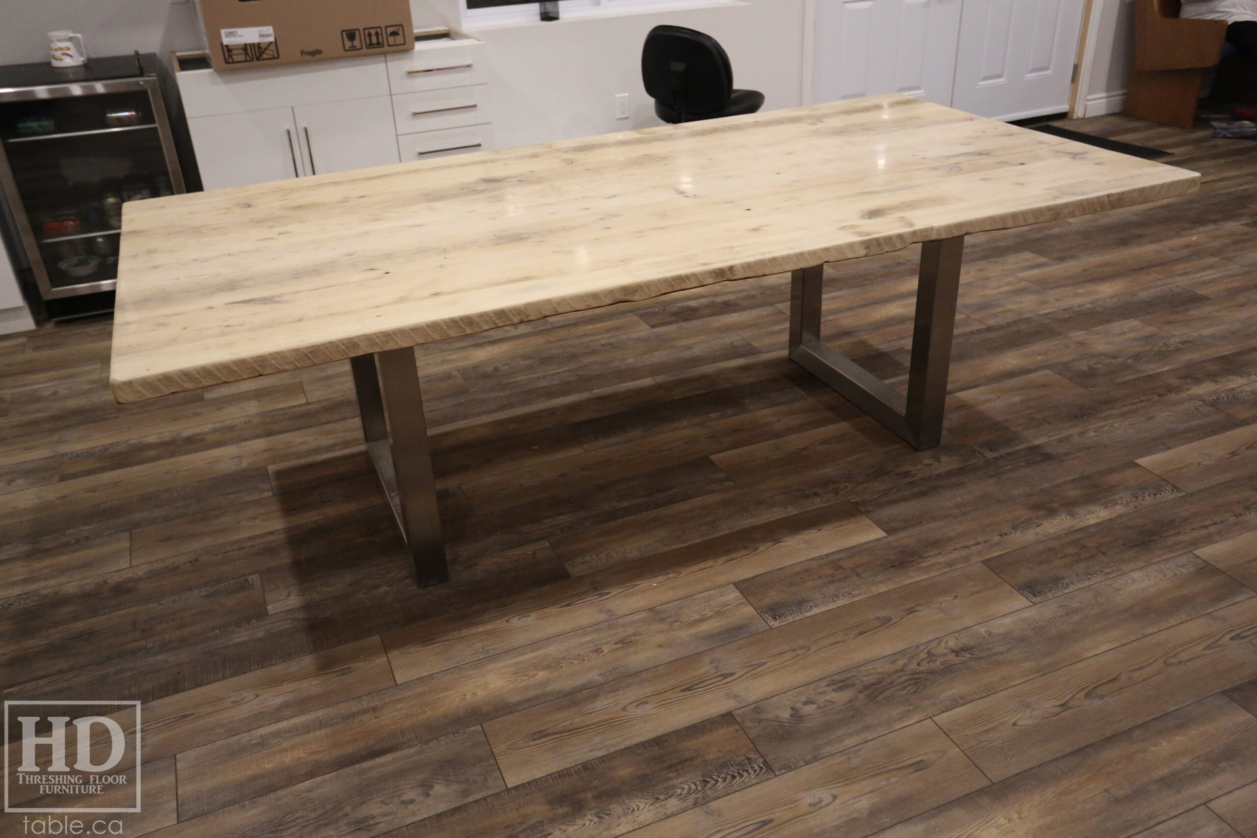 Project details: 8' Ontario Barnwood Boardroom Table - 48" wide â€“ Stainless Steel U Shaped Base â€“ Reclaimed Old Growth Hemlock Threshing Floor Construction â€“ No bread-edge boards - Original edges & distressing maintained â€“ Bleached Option - Premium epoxy + satin polyurethane finish - www.table.ca