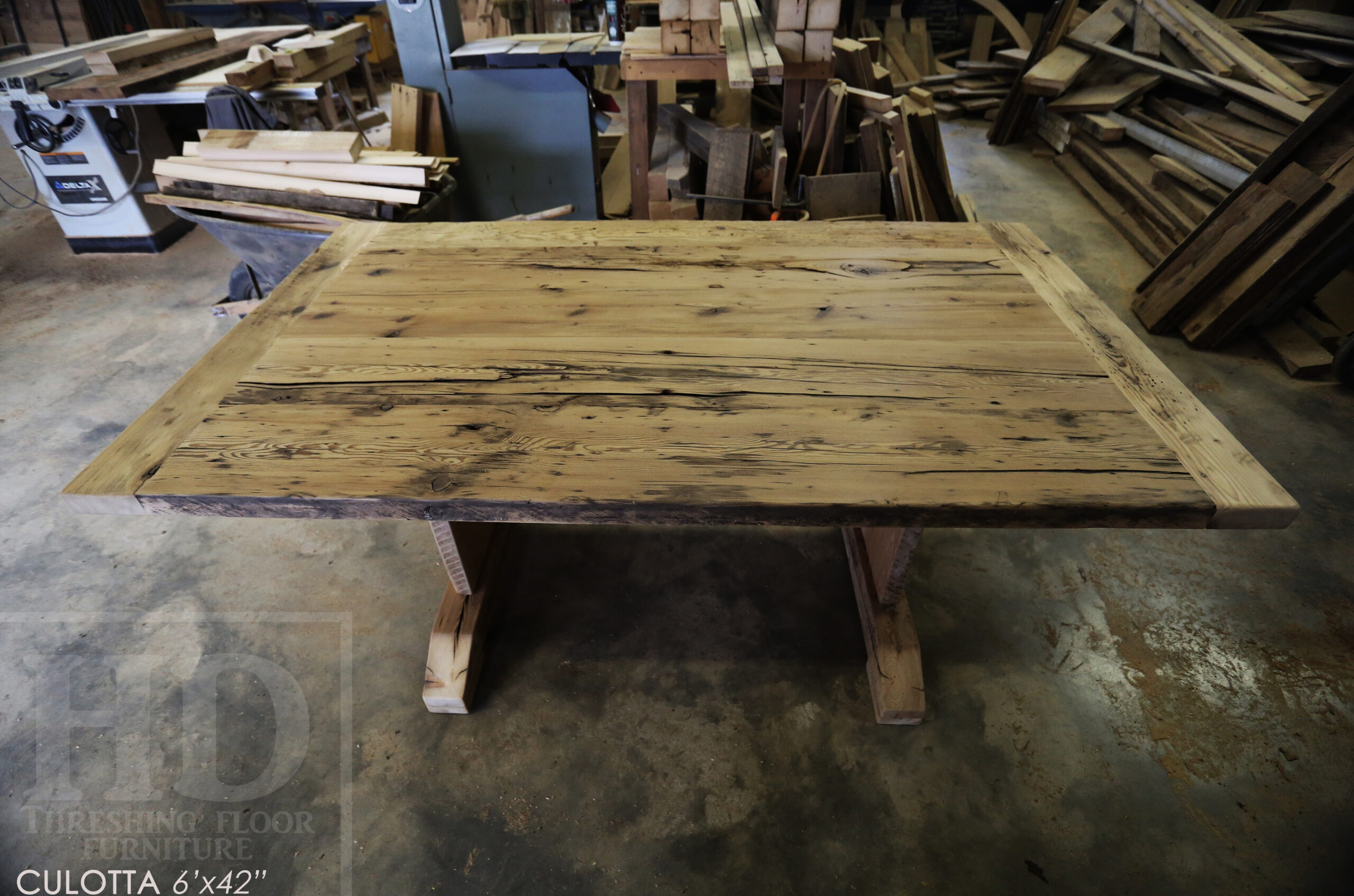 6â€™ Reclaimed Ontario Barnwood Table we made for a Waterdown, Ontario home â€“ Trestle Base [No bottom rail option] - Old Growth Hemlock Threshing Floor Construction â€“ Original edges & distressing maintained â€“Bread Edges - Premium epoxy + satin polyurethane finish - www.table.ca