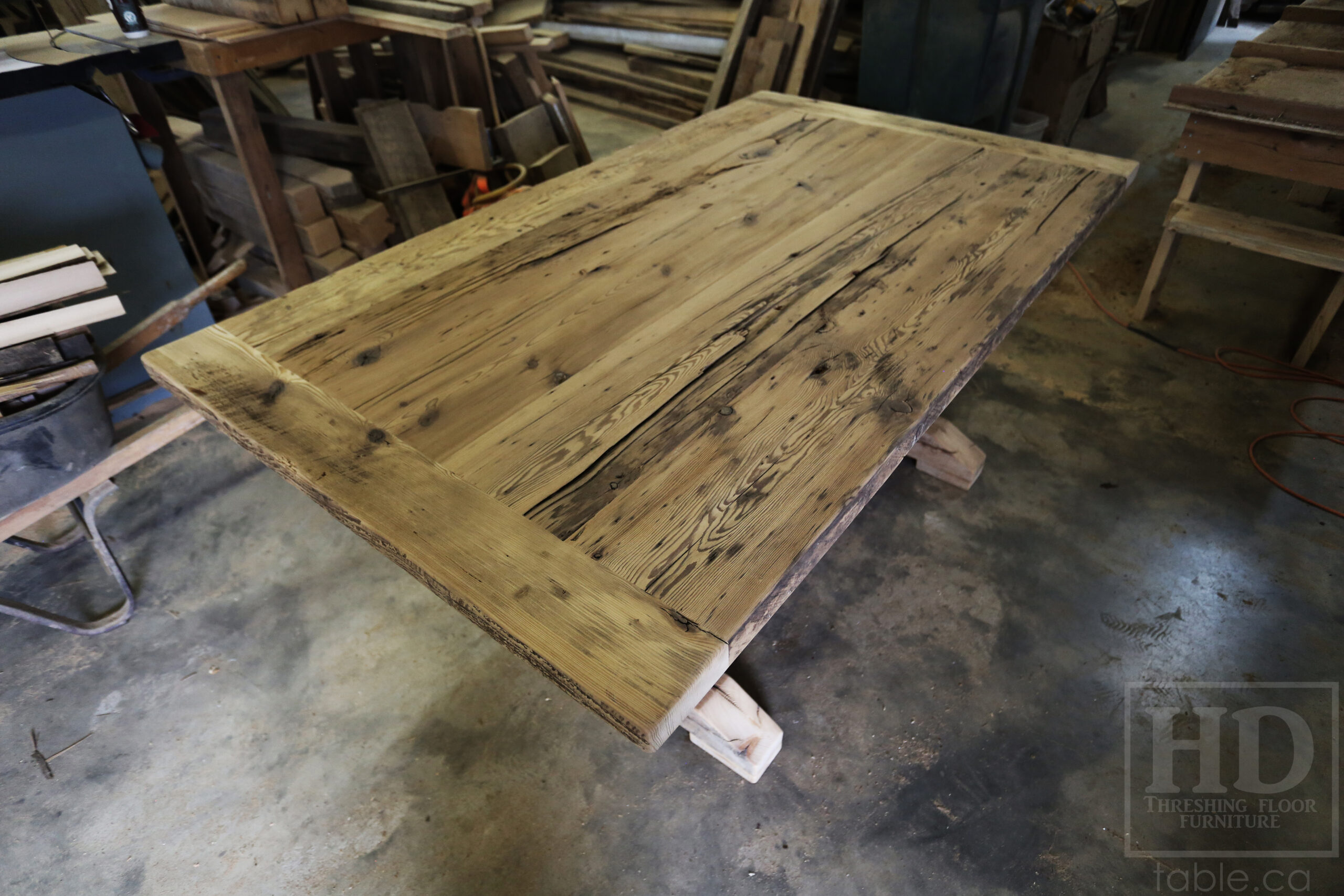 6â€™ Reclaimed Ontario Barnwood Table we made for a Waterdown, Ontario home â€“ Trestle Base [No bottom rail option] - Old Growth Hemlock Threshing Floor Construction â€“ Original edges & distressing maintained â€“Bread Edges - Premium epoxy + satin polyurethane finish - www.table.ca