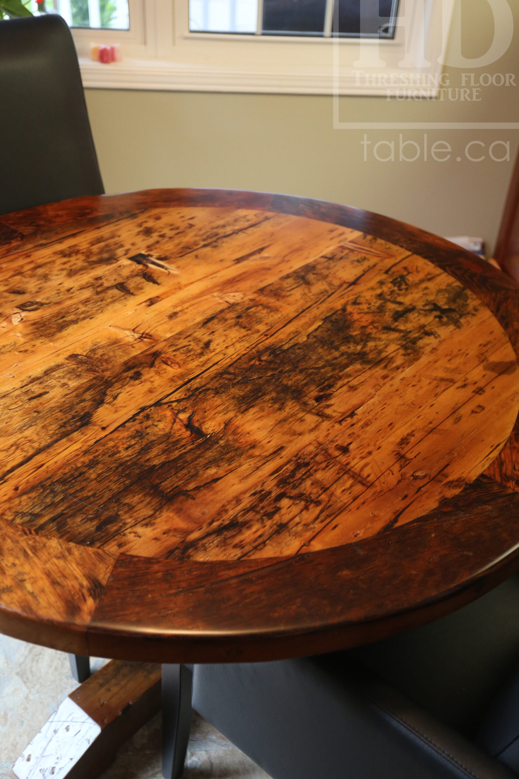 44” Reclaimed Ontario Barnwood Round Table we made for a Waterloo, Ontario home – Pedestal Base - Old Growth Hemlock Threshing Floor Construction – Original edges & distressing maintained – Circular Bread Edges - Premium epoxy + satin polyurethane finish – 2 Black Arm Topgrain Leather Parsons Chairs - www.table.ca