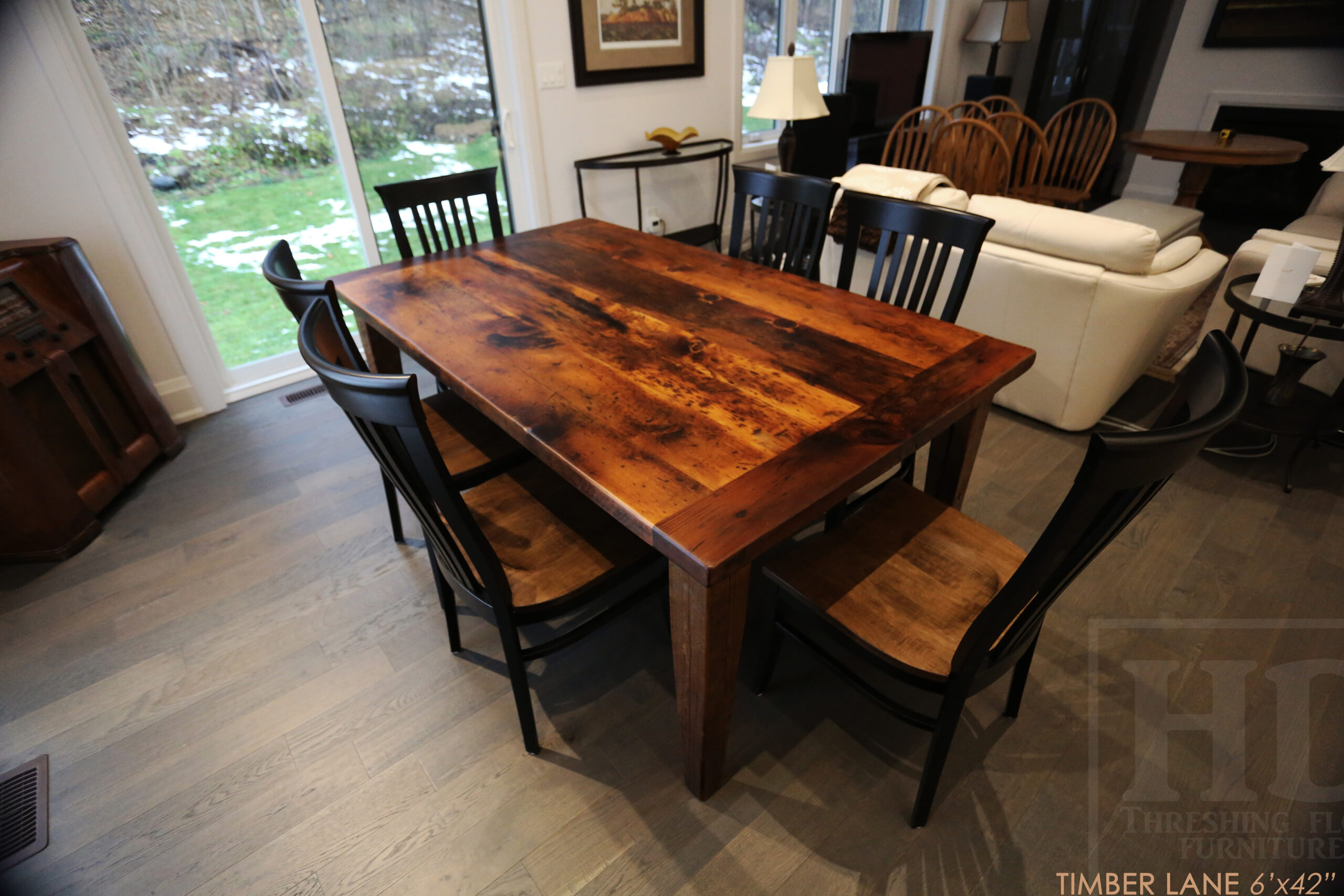 Project summary: 6’ Reclaimed Ontario Barnwood Table we made for an Thornbury, Ontario home – 42” wide – Harvest Base / Tapered Windbrace Beam Legs - [2] Drawers 24” wide on long sides - Old Growth Hemlock Threshing Floor Construction - Original edges & distressing maintained – Bread Edge Ends - Premium epoxy + matte polyurethane finish – [6] Athena Chairs / Wormy Maple / Black Painted Frame; Seat Stained Colour of Table / Polyurethane clearcoat finish - www.table.ca