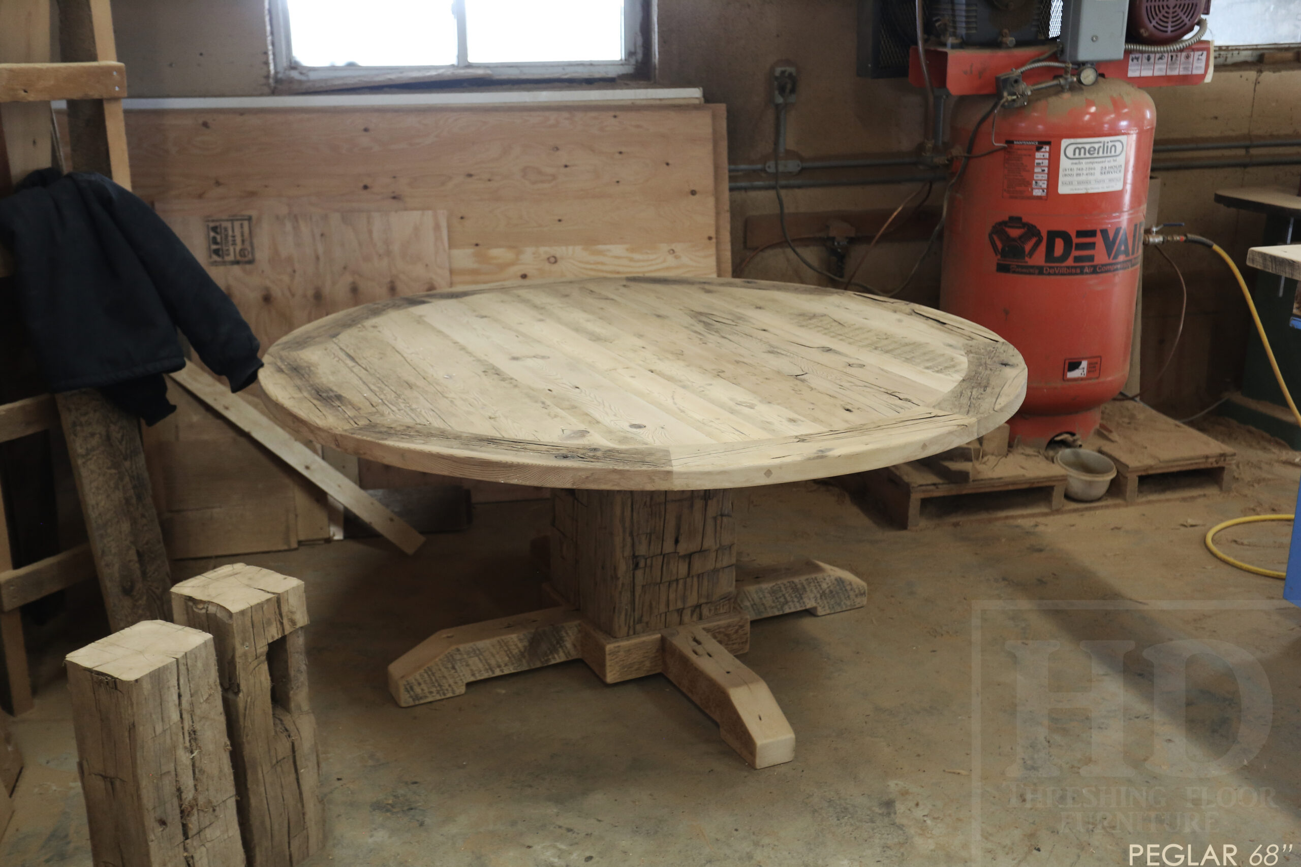 Project summary: 68” Round Reclaimed Ontario Barnwood Table we made for a Toronto, Ontario home – Hand-Hewn Beam Pedestal Base - Old Growth Hemlock Threshing Floor Construction – Original edges & distressing maintained – Circular Bread Edges – Bleached Option - Premium epoxy + super matte polyurethane finish – www.table.ca