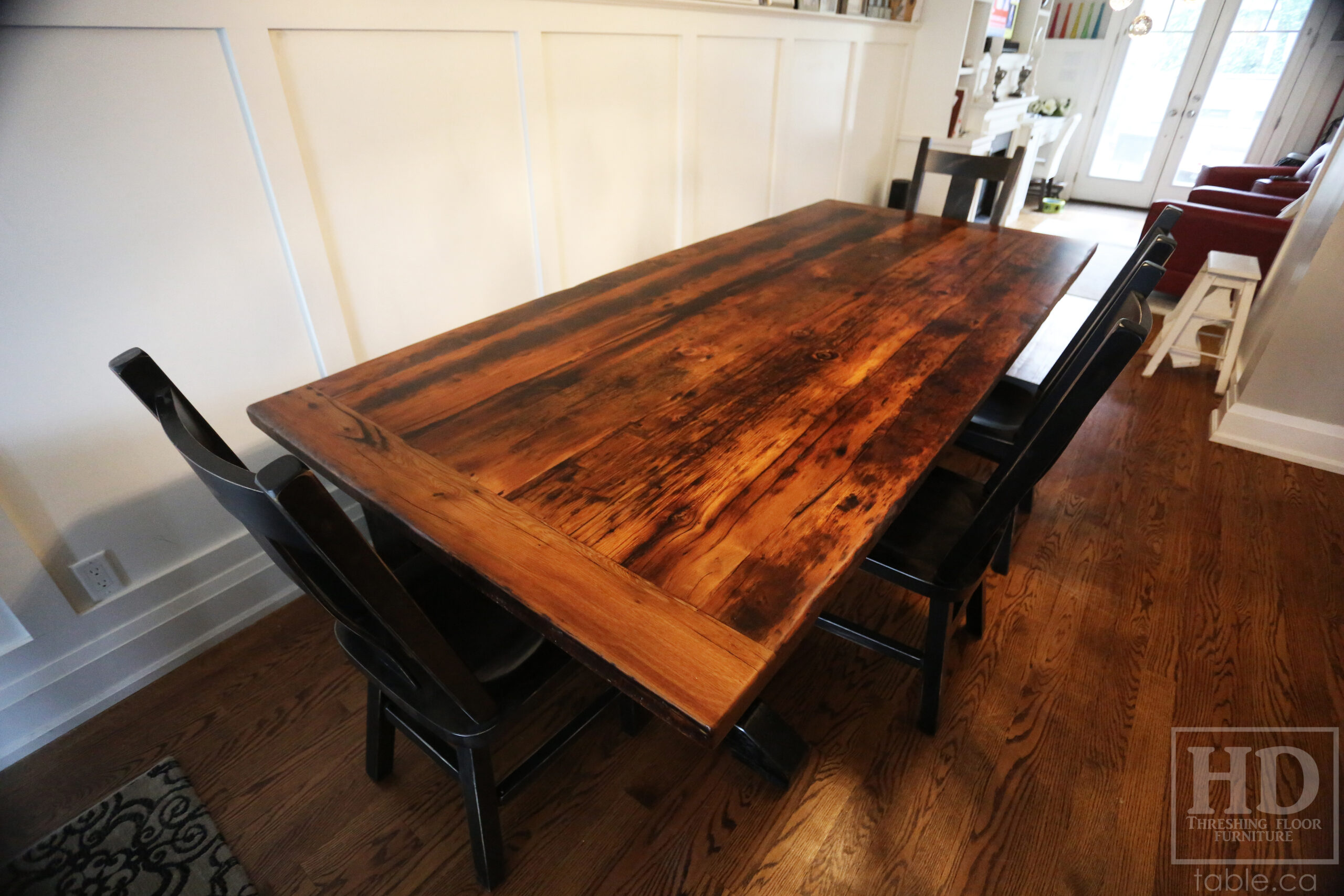 9’ Reclaimed Ontario Barnwood Table we made for a Toronto, Ontario home – 48” wide –  Sawbuck Base - Old Growth Hemlock Threshing Floor Construction - Original edges & distressing maintained – Bread Edge Ends – Black with Sandthroughs Base - Premium epoxy + satin polyurethane finish – [2] Matching 4’ Benches – 4 Plank Back Chairs / Wormy Maple / Black with Sandthroughs Frame / Polyurethane clearcoat finish - www.table.ca