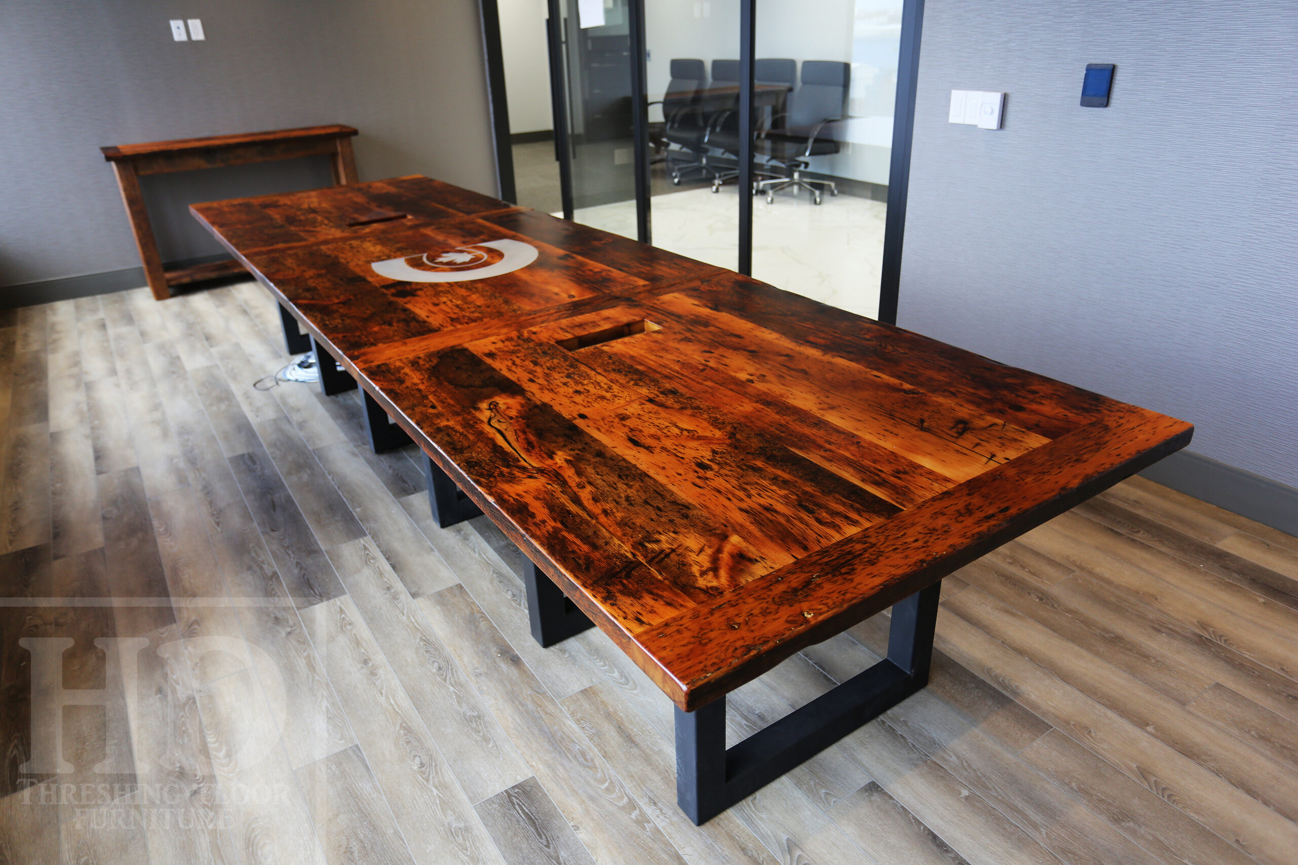 Project details: 14â€™ Reclaimed Ontario Barnwood Boardroom Table we made for a Maple, Ontario office â€“ 48â€ wide â€“  Matte Black U Shaped Base  - Old Growth Pine Threshing Floor Construction - Original edges & distressing maintained â€“ Bread Edge Ends â€“ Premium epoxy + matte polyurethane finish - www.table.ca