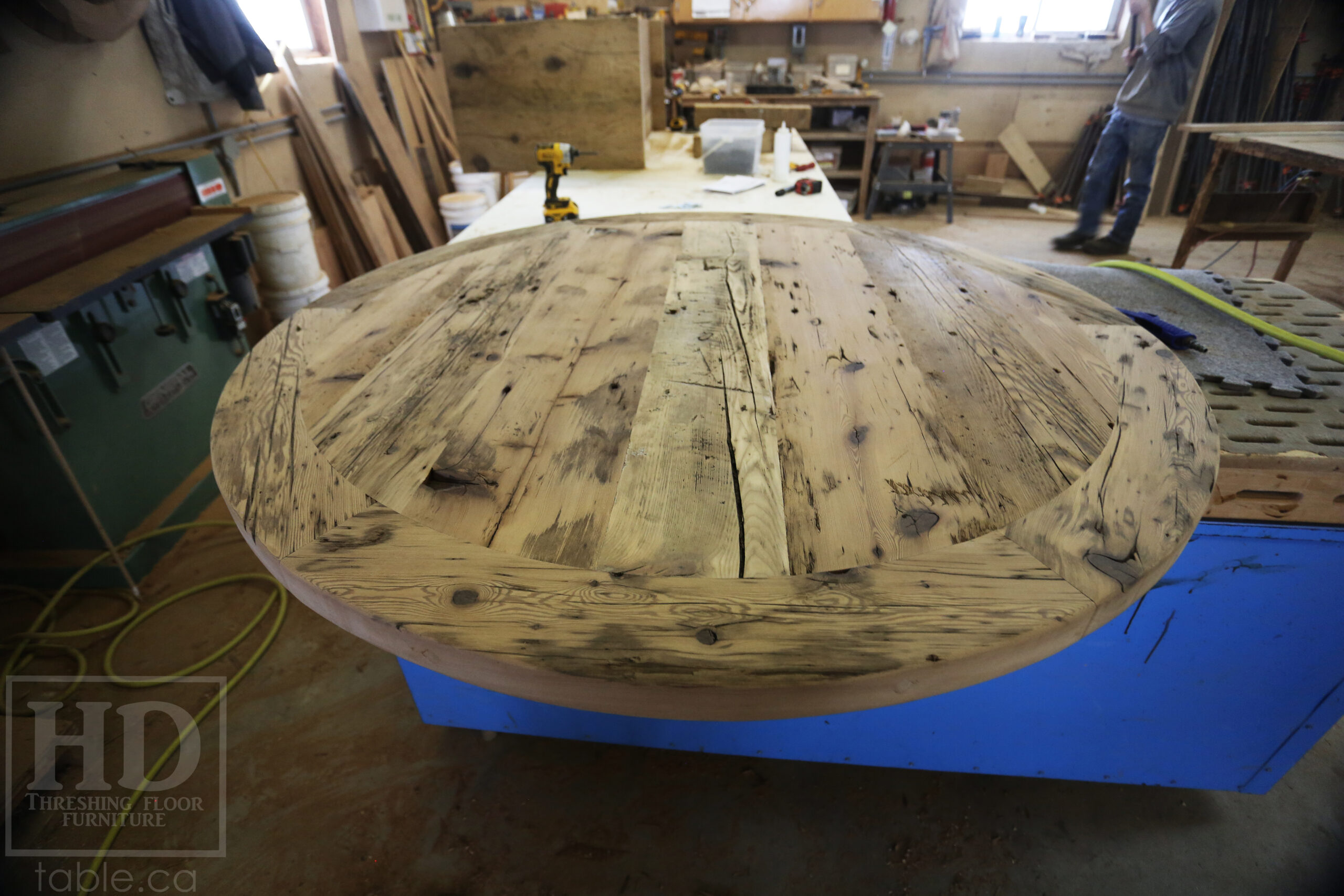 54â€ Reclaimed Ontario Barnwood Round Table â€“ Trestle Base - Old Growth Pine Threshing Floor Construction - Original edges & distressing maintained â€“ Circular Bread Edging â€“ Premium epoxy + satin polyurethane finish - www.table.ca