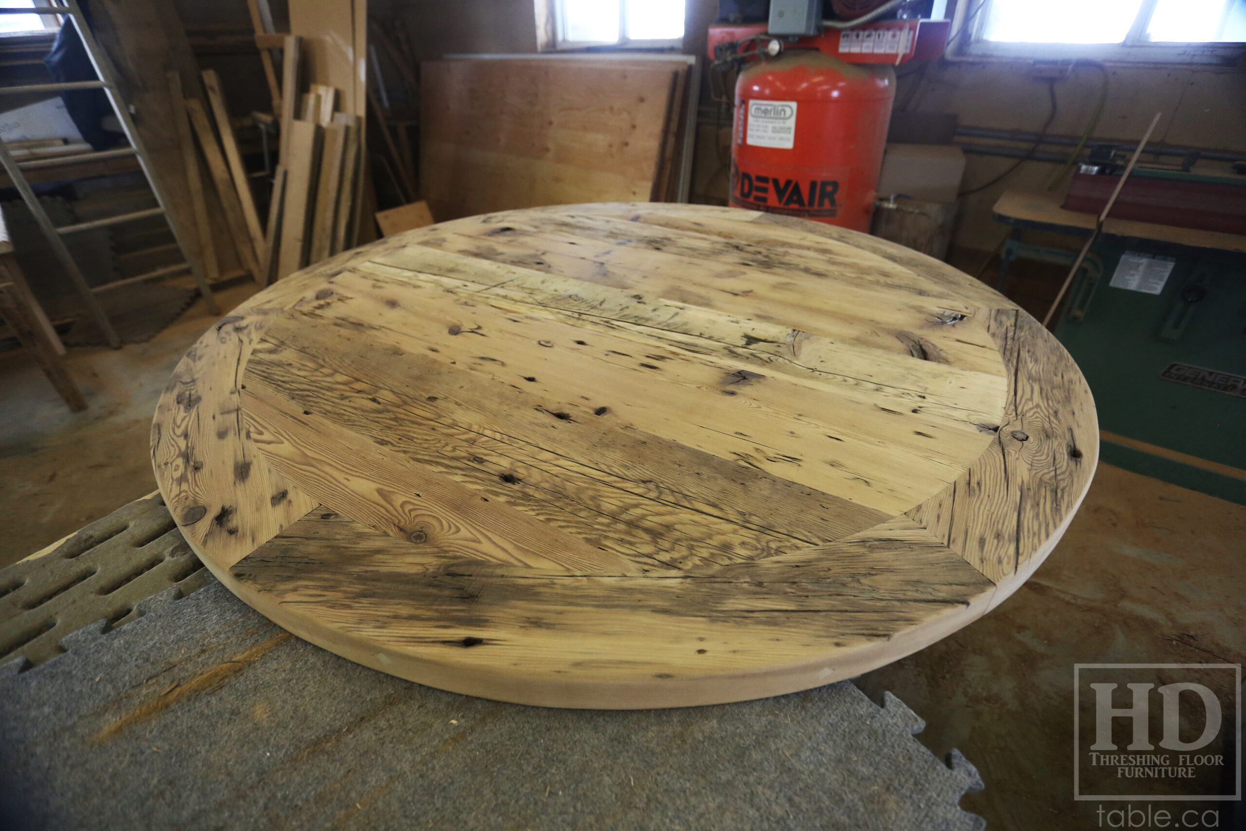 54â€ Reclaimed Ontario Barnwood Round Table â€“ Trestle Base - Old Growth Pine Threshing Floor Construction - Original edges & distressing maintained â€“ Circular Bread Edging â€“ Premium epoxy + satin polyurethane finish - www.table.ca