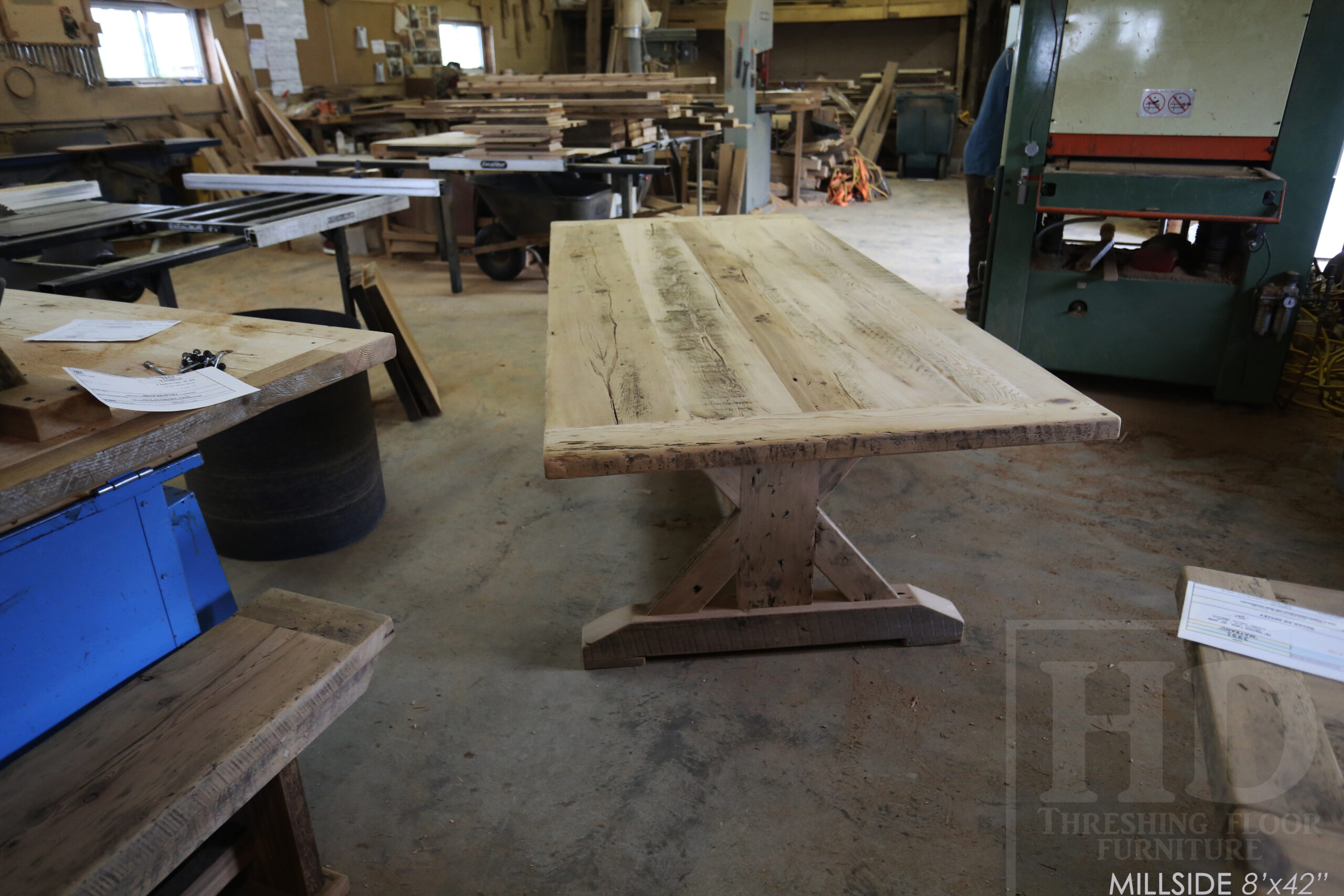 Project summary: 8â€™ Reclaimed Ontario Barnwood Table we made for an Innerkip, Ontario home â€“ 42â€ wide â€“ Sawbuck Base - Old Growth Hemlock Threshing Floor Construction â€“ Greytone Option  - Original edges & distressing maintained â€“ Bread Edge Ends - Premium epoxy + satin polyurethane finish â€“ 8â€™ Reclaimed Wood Bench [matching] - www.table.ca