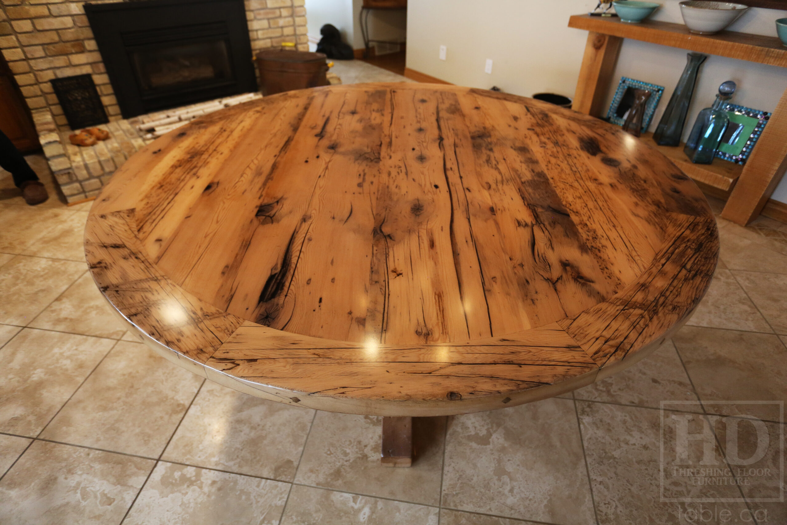 72” Reclaimed Ontario Barnwood Round Table we made for a Lakeside, Ontario home – Hand-Hewn Beam Post Base - Old Growth Hemlock Threshing Floor Construction - Original edges & distressing maintained – Bread Edge Boards –Premium epoxy + satin polyurethane finish – Greytone Option - www.table.ca