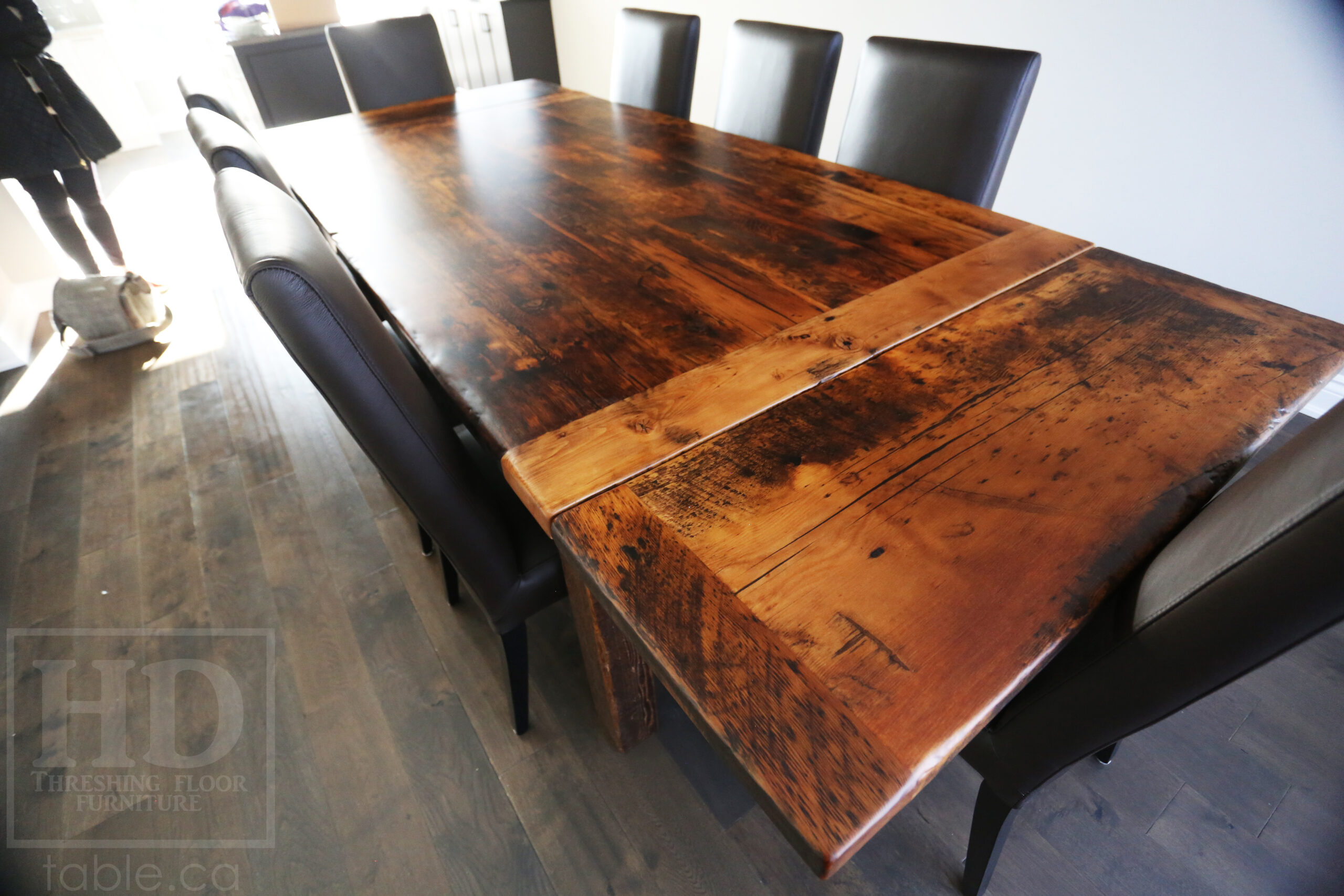 7’ Reclaimed Ontario Barnwood Table we made for a Milton, Ontario home – 48” wide – Harvest Base / Straight 4”x4” Windbrace Beam Legs - Old Growth Hemlock Threshing Floor Construction - Original edges & distressing maintained – Bread Edge Board Ends – Premium epoxy + matte polyurethane finish – Two 18” Leaf Extensions – 8 Topgrain Leather Parsons Chairs / Santiago Black - www.table.ca