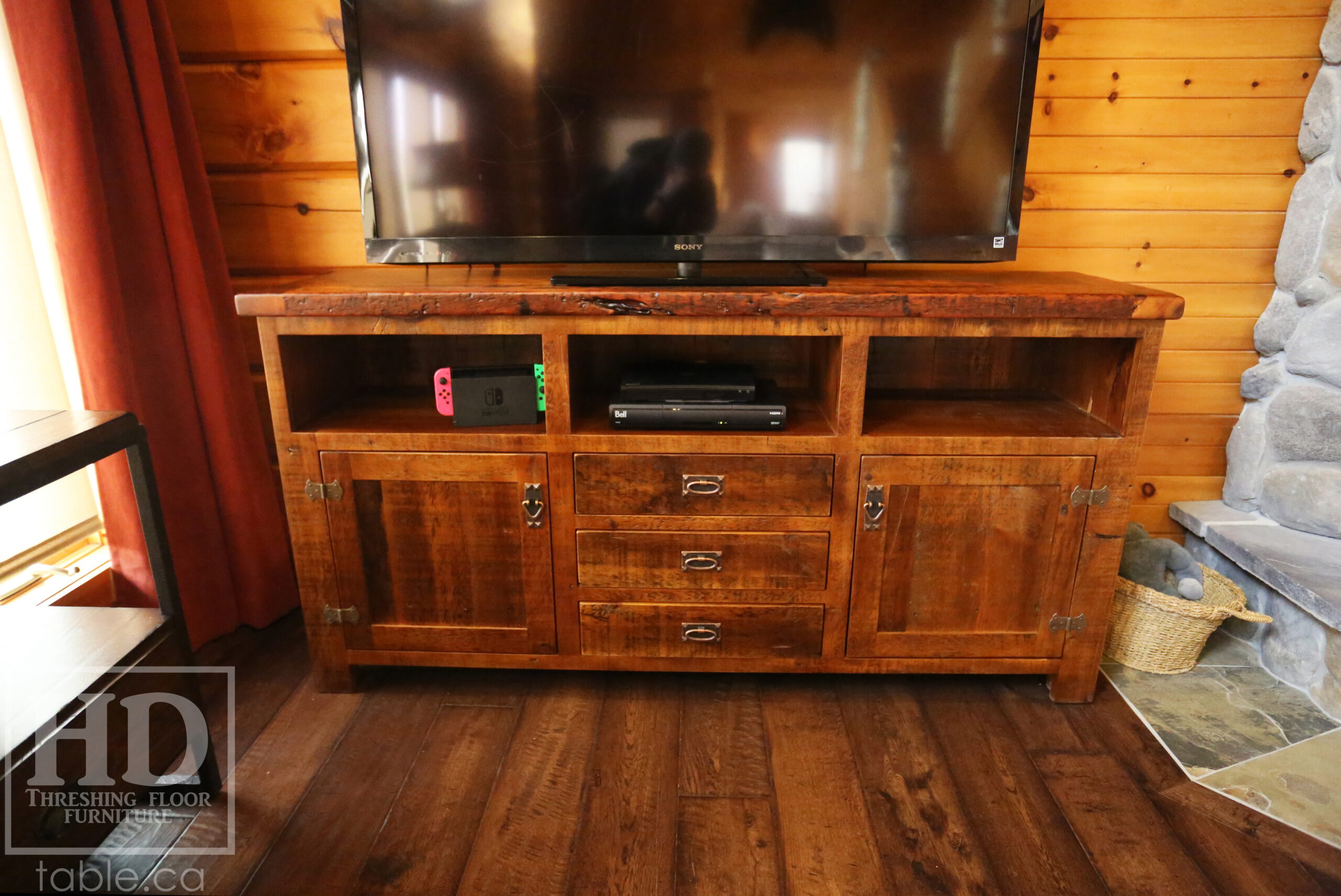 6’ Reclaimed Ontario Barnwood TV Unit we made for a Vienna, Ontario home – 18” deep – 36” height – Open Shelving – Centre 3 Drawers / 2 Outside Bottom Doors - Old Growth Pine Threshing Floor & Grainery Board Construction - Original edges & distressing maintained – Bread Edge Board Ends – Premium epoxy + matte polyurethane finish – Mission Cast Brass Lee Valley Hardware - www.table.ca