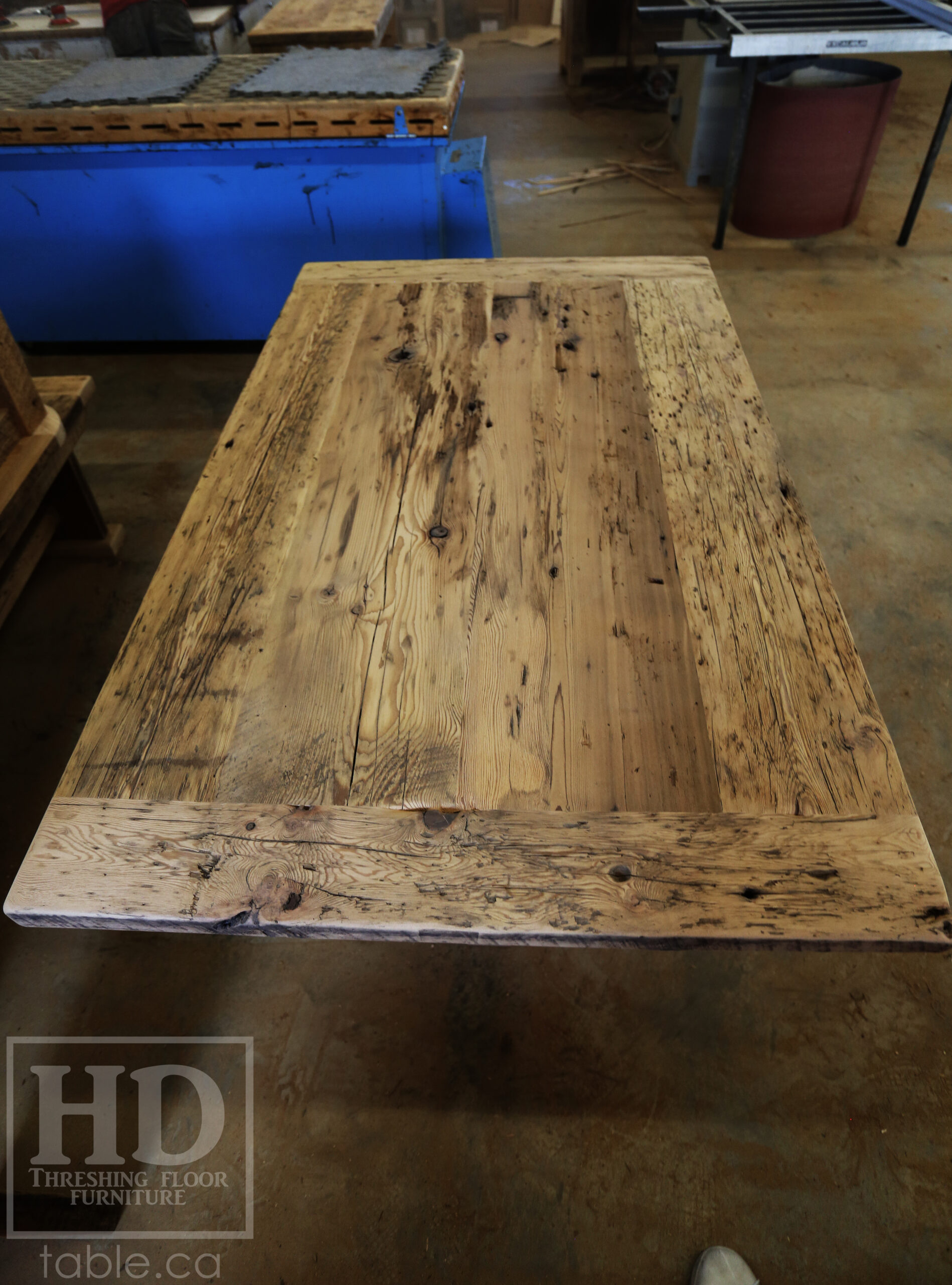 Project Summary: 60â€ Reclaimed Ontario Barnwood Coffee Table â€“ 37â€ wide â€“ 30â€ height â€“ Hand-Hewn Beam Pedestal Base -  Old Growth Hemlock Threshing Floor Construction - Original edges & distressing maintained â€“ Bread Edge Boards â€“ Greytone Option - Premium epoxy + satin polyurethane finish - www.table.ca