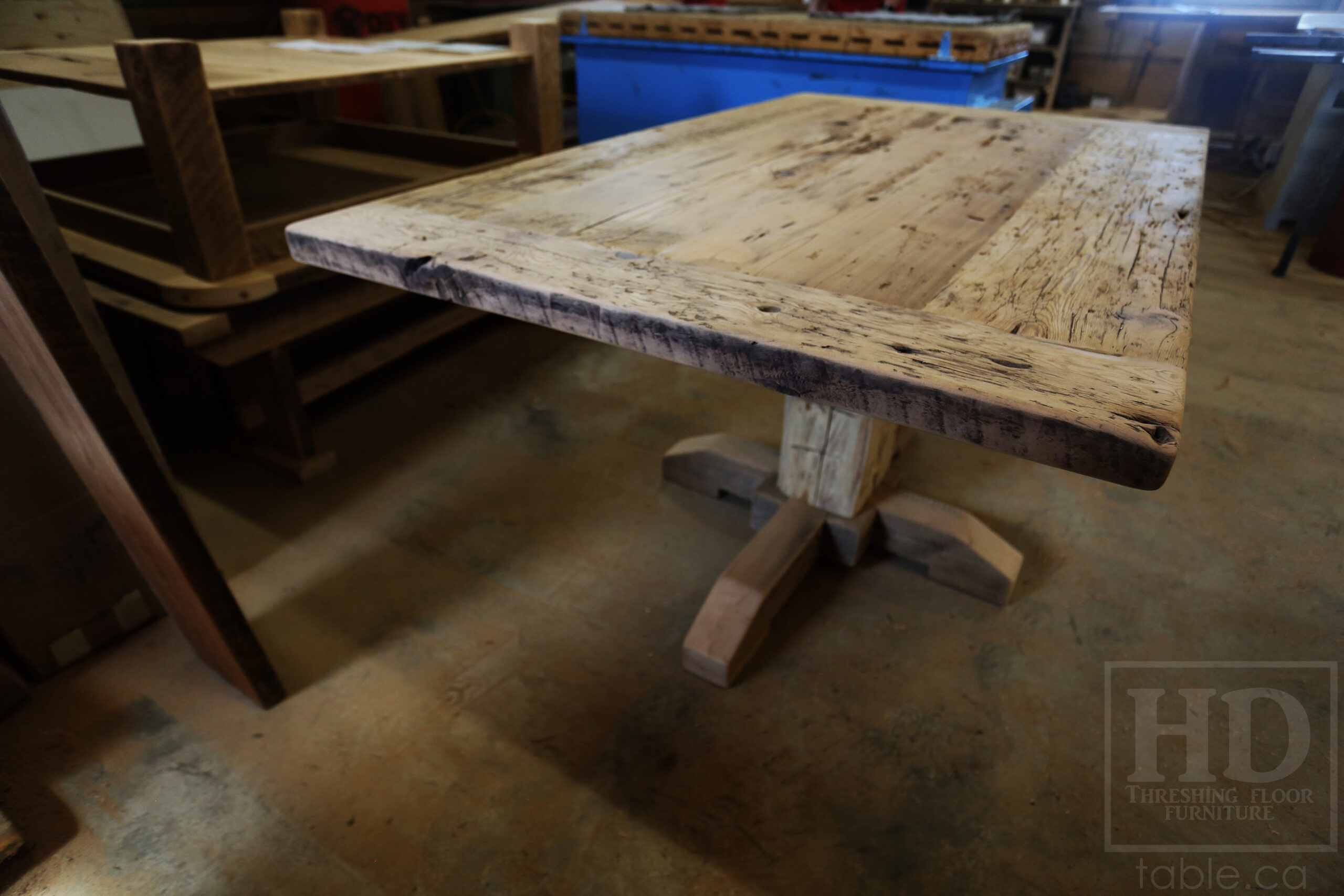 Project Summary: 60â€ Reclaimed Ontario Barnwood Coffee Table â€“ 37â€ wide â€“ 30â€ height â€“ Hand-Hewn Beam Pedestal Base -  Old Growth Hemlock Threshing Floor Construction - Original edges & distressing maintained â€“ Bread Edge Boards â€“ Greytone Option - Premium epoxy + satin polyurethane finish - www.table.ca