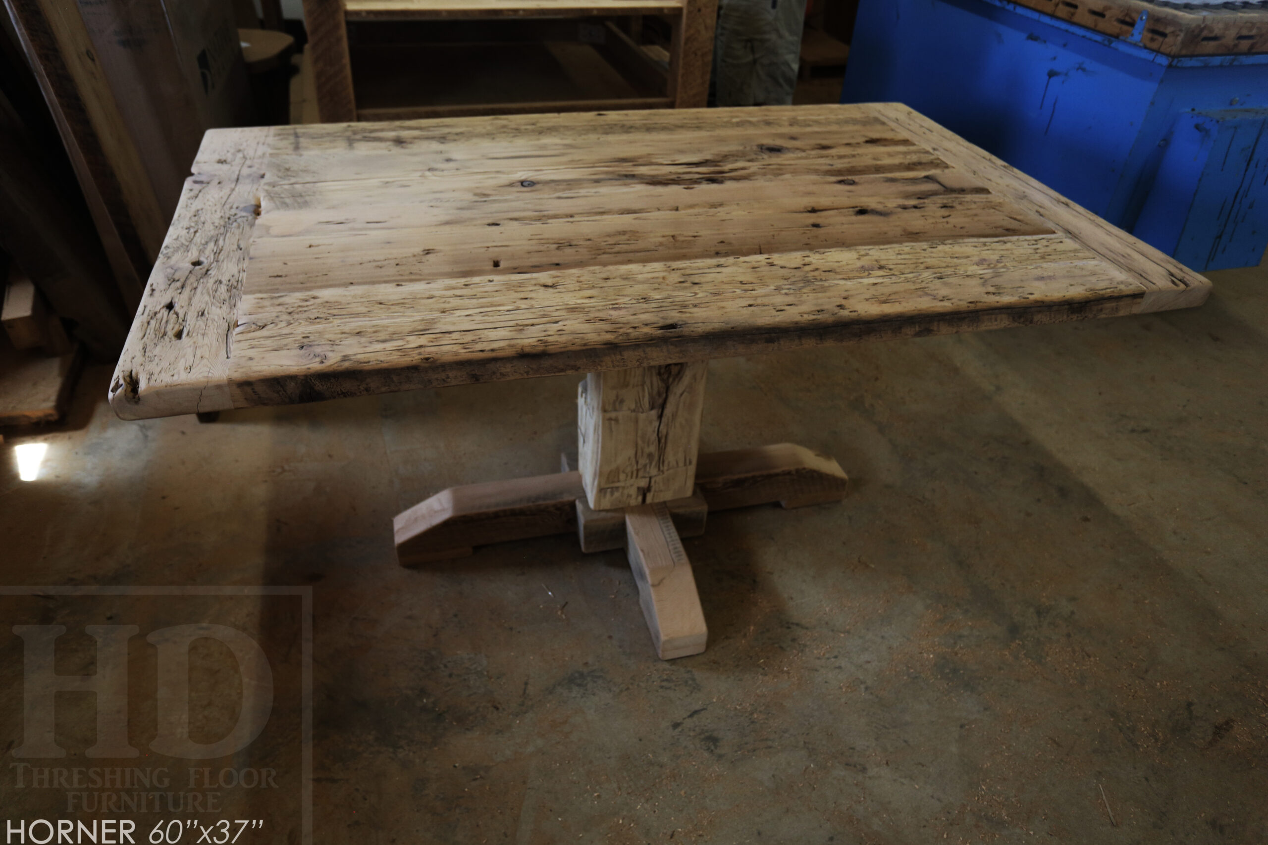 Project Summary: 60â€ Reclaimed Ontario Barnwood Coffee Table â€“ 37â€ wide â€“ 30â€ height â€“ Hand-Hewn Beam Pedestal Base -  Old Growth Hemlock Threshing Floor Construction - Original edges & distressing maintained â€“ Bread Edge Boards â€“ Greytone Option - Premium epoxy + satin polyurethane finish - www.table.ca