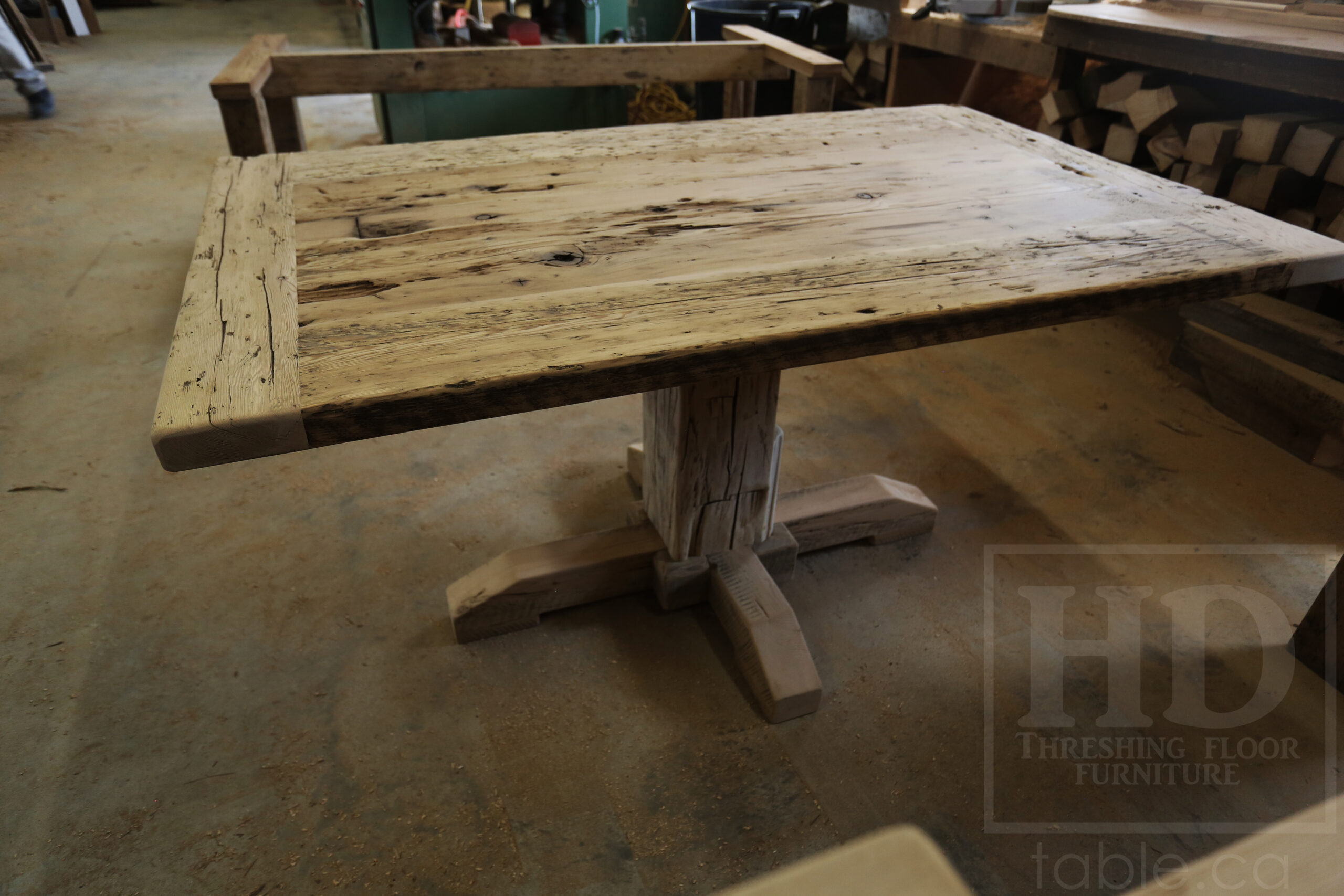 Project Summary: 60â€ Reclaimed Ontario Barnwood Coffee Table â€“ 37â€ wide â€“ 30â€ height â€“ Hand-Hewn Beam Pedestal Base -  Old Growth Hemlock Threshing Floor Construction - Original edges & distressing maintained â€“ Bread Edge Boards â€“ Greytone Option - Premium epoxy + satin polyurethane finish - www.table.ca