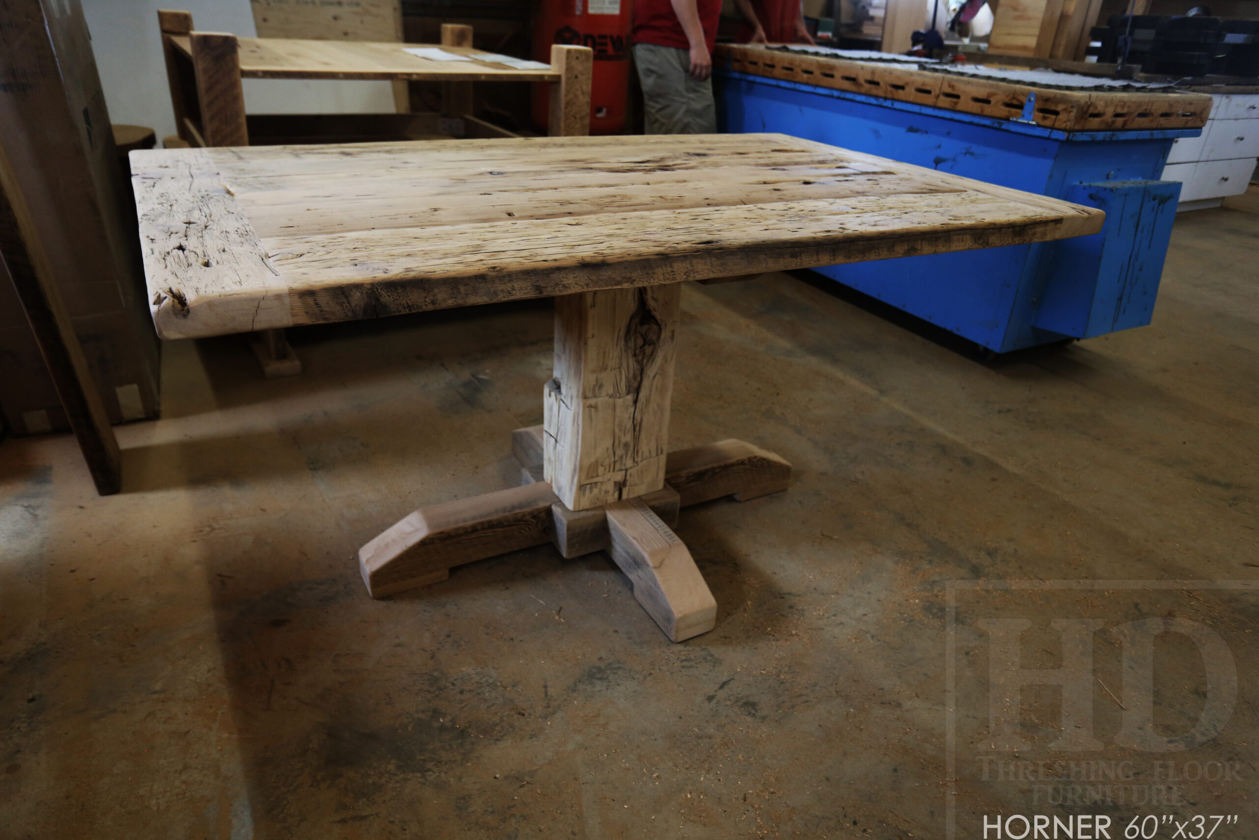 Project Summary: 60â€ Reclaimed Ontario Barnwood Coffee Table â€“ 37â€ wide â€“ 30â€ height â€“ Hand-Hewn Beam Pedestal Base -  Old Growth Hemlock Threshing Floor Construction - Original edges & distressing maintained â€“ Bread Edge Boards â€“ Greytone Option - Premium epoxy + satin polyurethane finish - www.table.ca