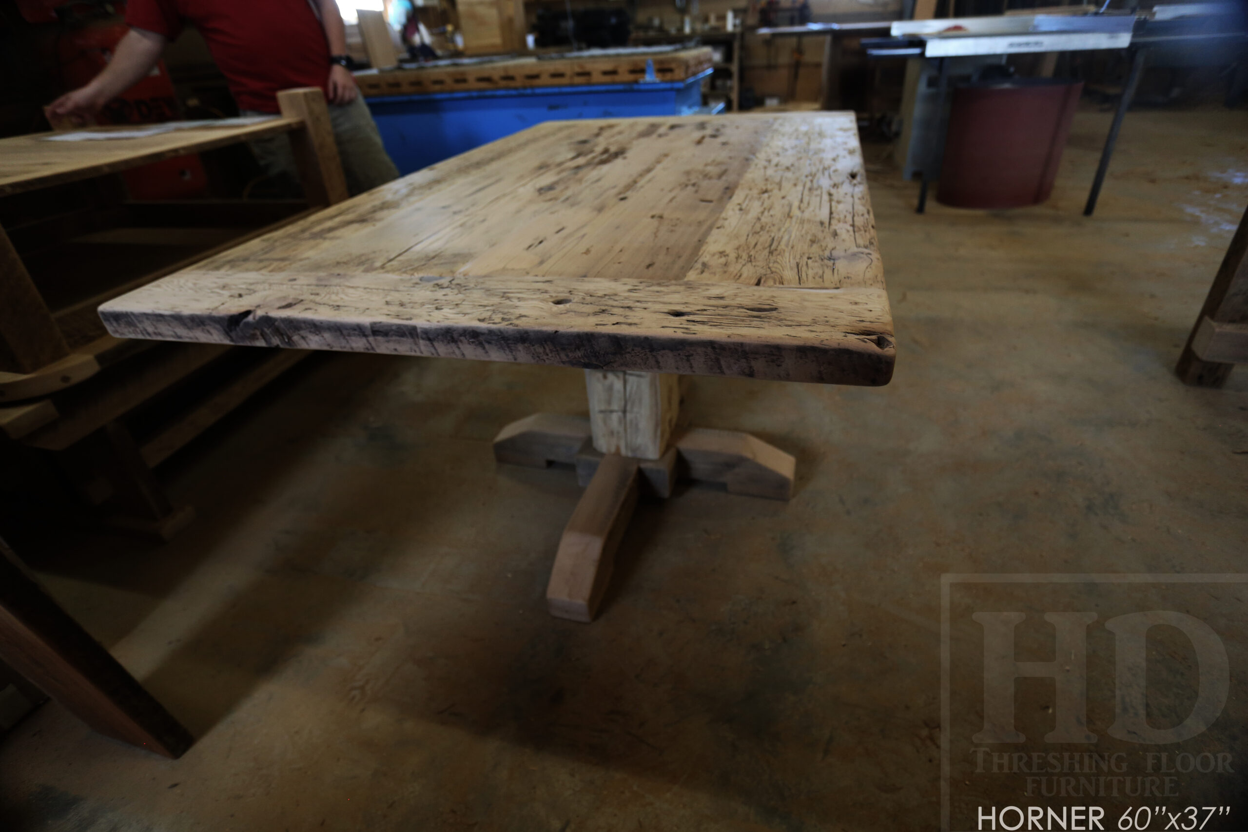 Project Summary: 60â€ Reclaimed Ontario Barnwood Coffee Table â€“ 37â€ wide â€“ 30â€ height â€“ Hand-Hewn Beam Pedestal Base -  Old Growth Hemlock Threshing Floor Construction - Original edges & distressing maintained â€“ Bread Edge Boards â€“ Greytone Option - Premium epoxy + satin polyurethane finish - www.table.ca