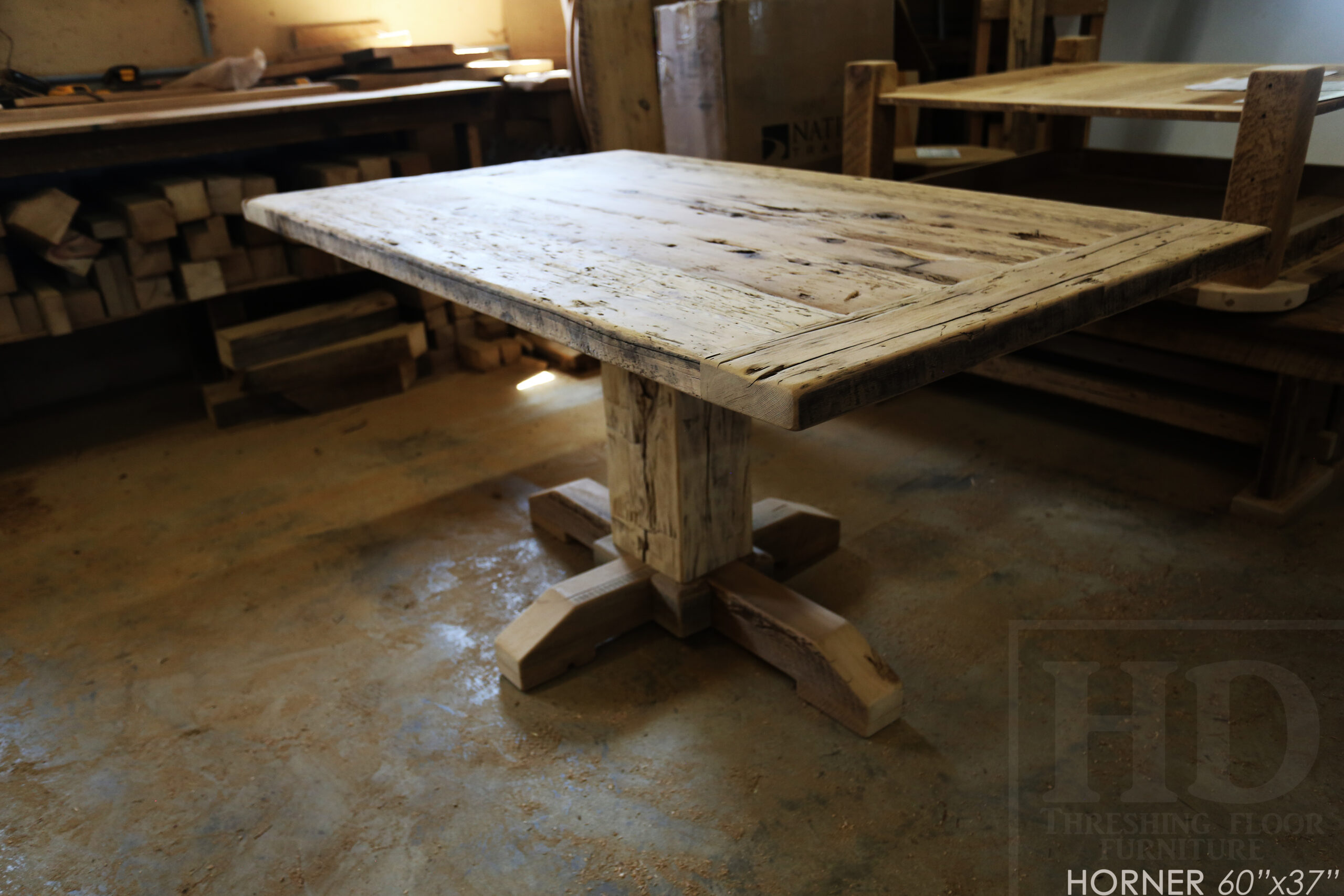 Project Summary: 60â€ Reclaimed Ontario Barnwood Coffee Table â€“ 37â€ wide â€“ 30â€ height â€“ Hand-Hewn Beam Pedestal Base -  Old Growth Hemlock Threshing Floor Construction - Original edges & distressing maintained â€“ Bread Edge Boards â€“ Greytone Option - Premium epoxy + satin polyurethane finish - www.table.ca