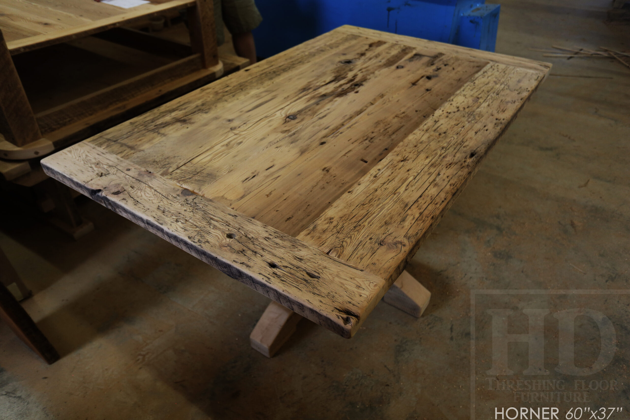 Project Summary: 60â€ Reclaimed Ontario Barnwood Coffee Table â€“ 37â€ wide â€“ 30â€ height â€“ Hand-Hewn Beam Pedestal Base -  Old Growth Hemlock Threshing Floor Construction - Original edges & distressing maintained â€“ Bread Edge Boards â€“ Greytone Option - Premium epoxy + satin polyurethane finish - www.table.ca