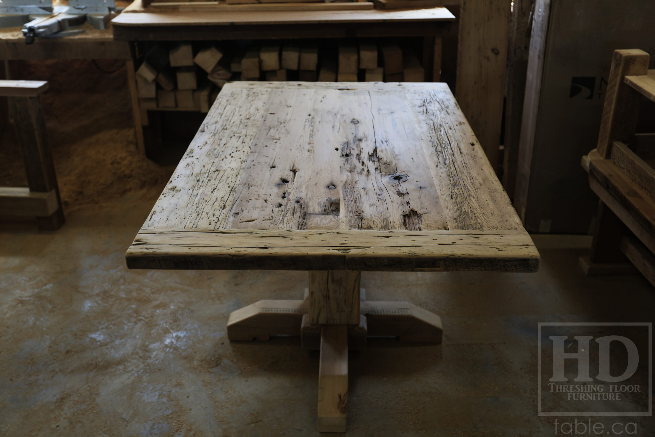 Project Summary: 60â€ Reclaimed Ontario Barnwood Coffee Table â€“ 37â€ wide â€“ 30â€ height â€“ Hand-Hewn Beam Pedestal Base -  Old Growth Hemlock Threshing Floor Construction - Original edges & distressing maintained â€“ Bread Edge Boards â€“ Greytone Option - Premium epoxy + satin polyurethane finish - www.table.ca