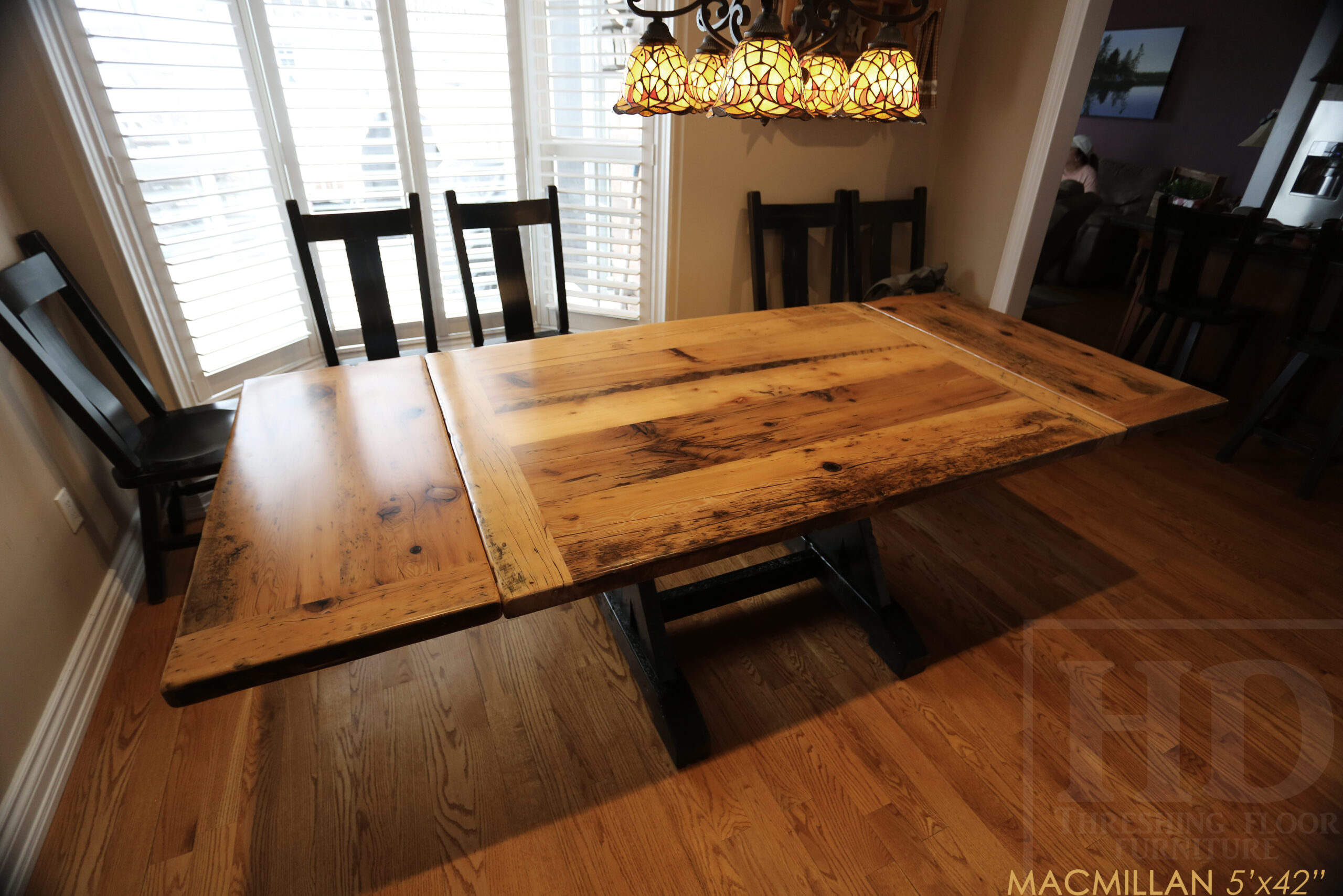 Project Summary: 5â€™ Reclaimed Barnwood Table we made for a Caledonia, Ontario home â€“ 42â€ wide - Sawbuck Base [Painted Black] - Old Growth Hemlock Threshing Floor 2â€ Construction - Original edges & distressing maintained â€“ Bread Edge Boards â€“ Greytone Option - Premium epoxy + satin polyurethane finish â€“ Two 12â€ Leaves â€“ Wormy Maple Plank Back Chairs / Painted Black with Sandthroughs - www.table.ca